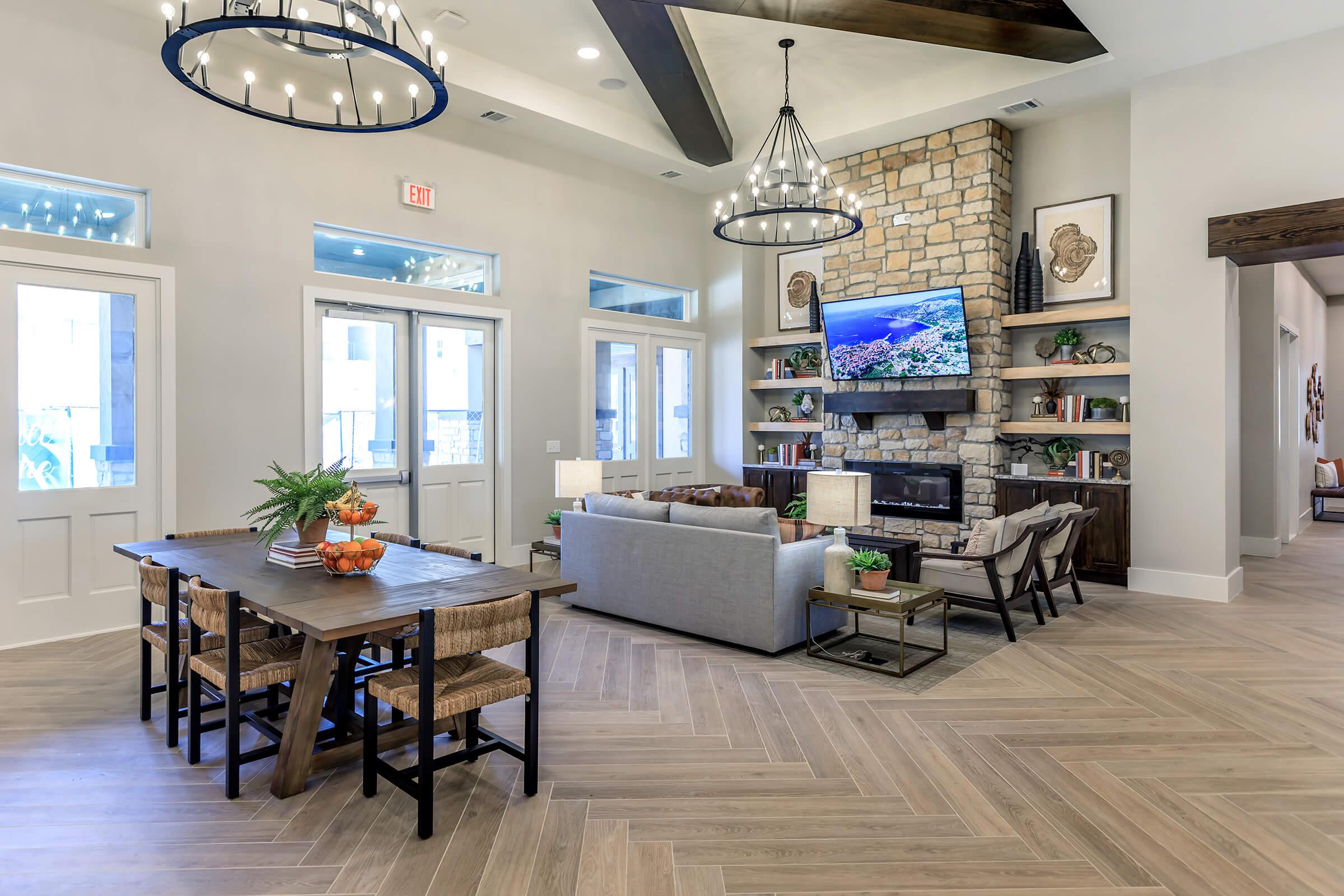 a living room filled with furniture and a large window