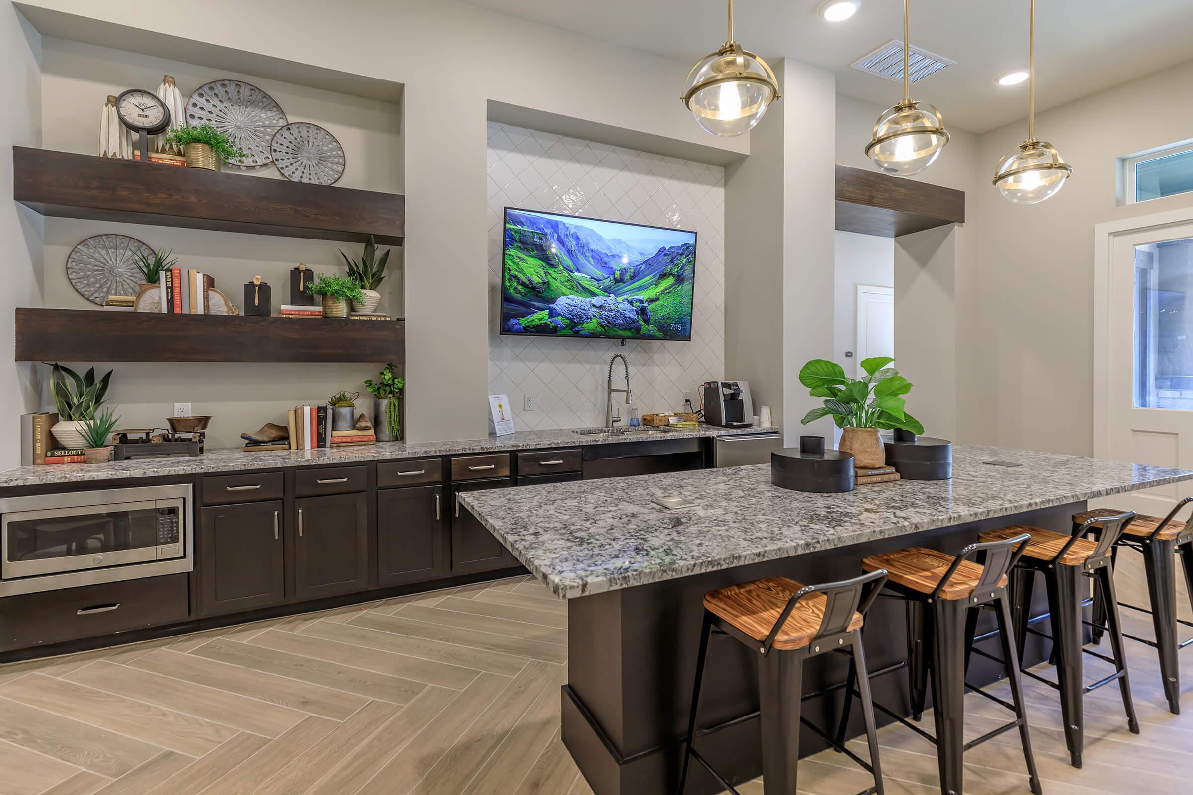 a kitchen with a table and chairs