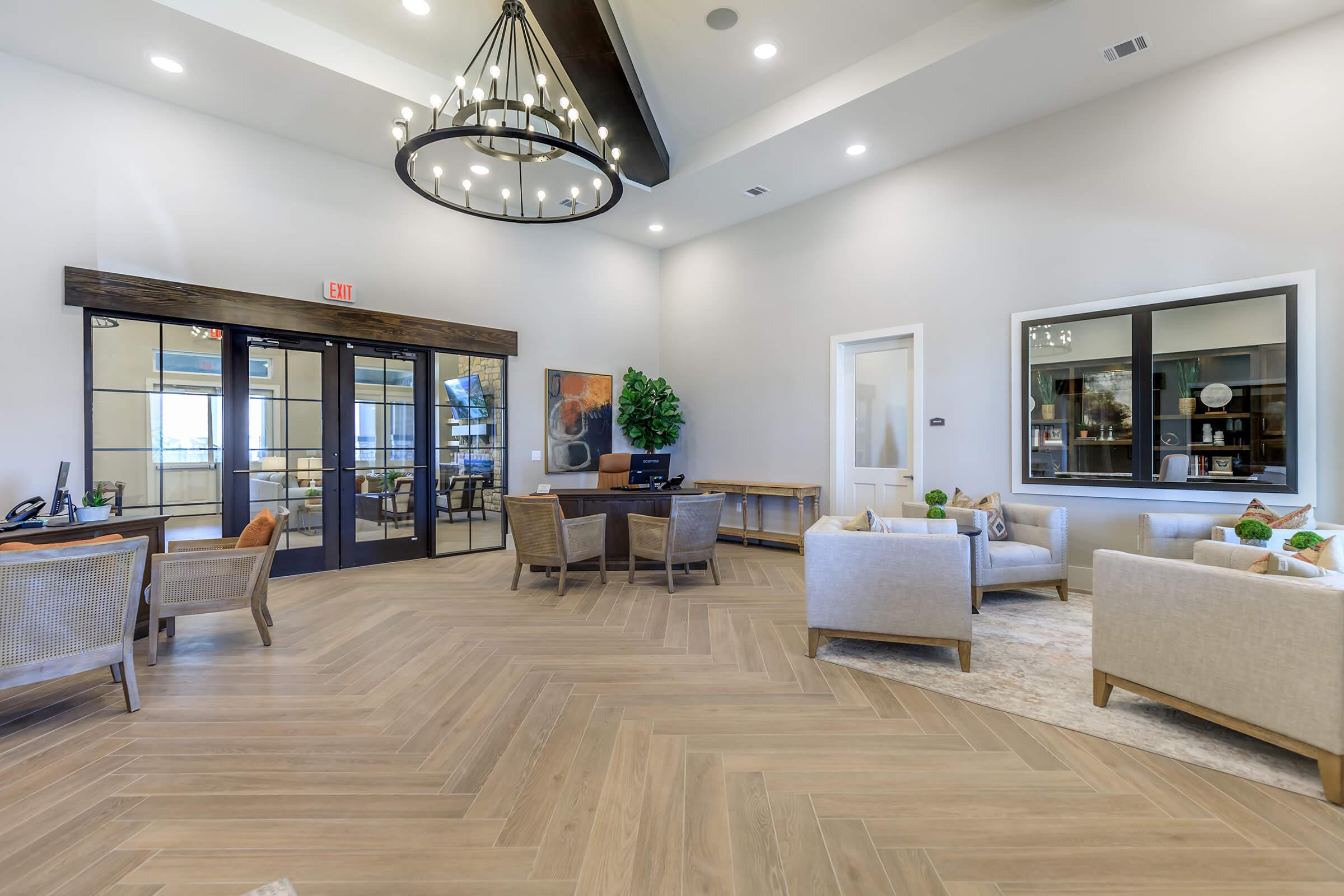 a living room filled with furniture and a large window