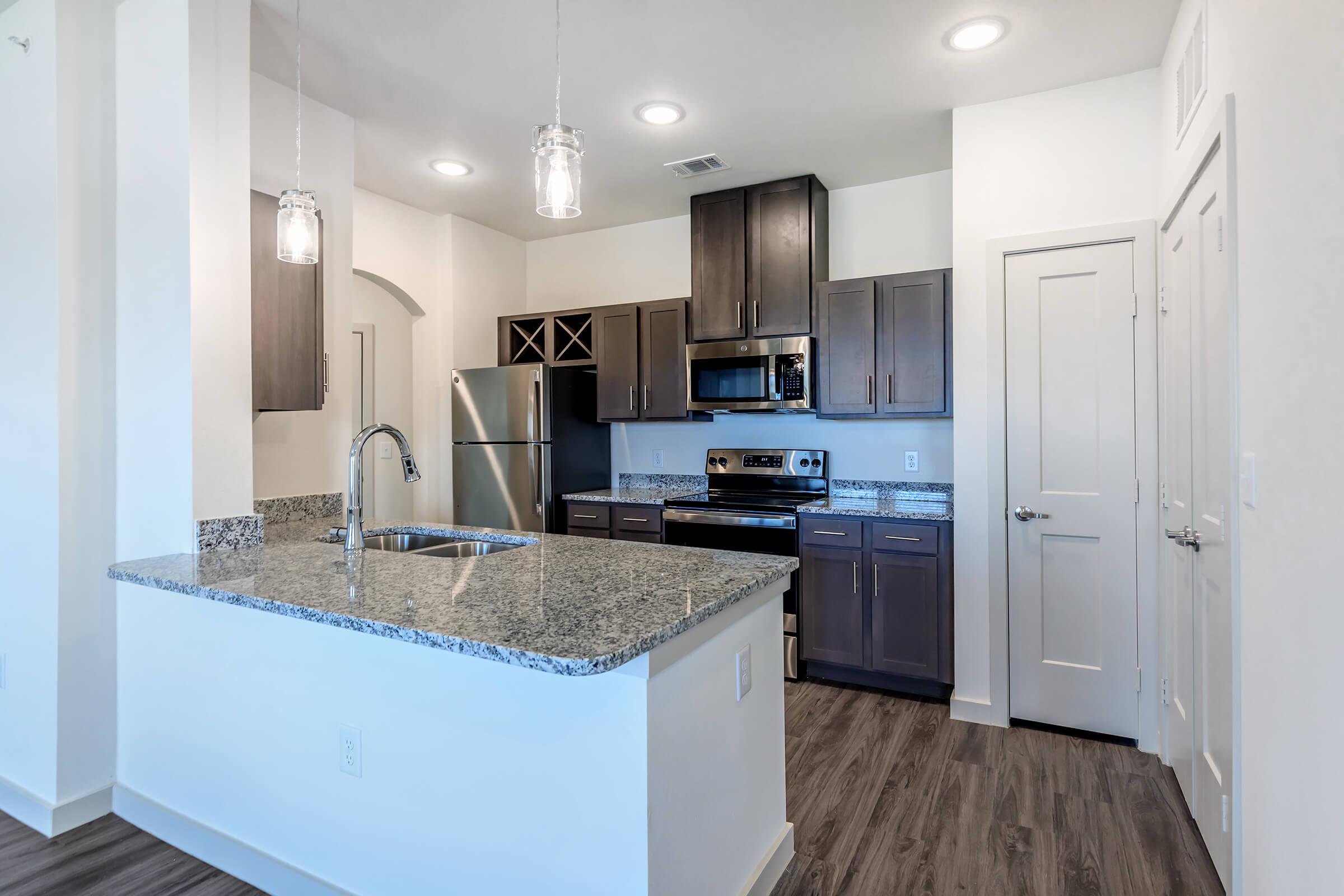 a kitchen with a stove and a sink