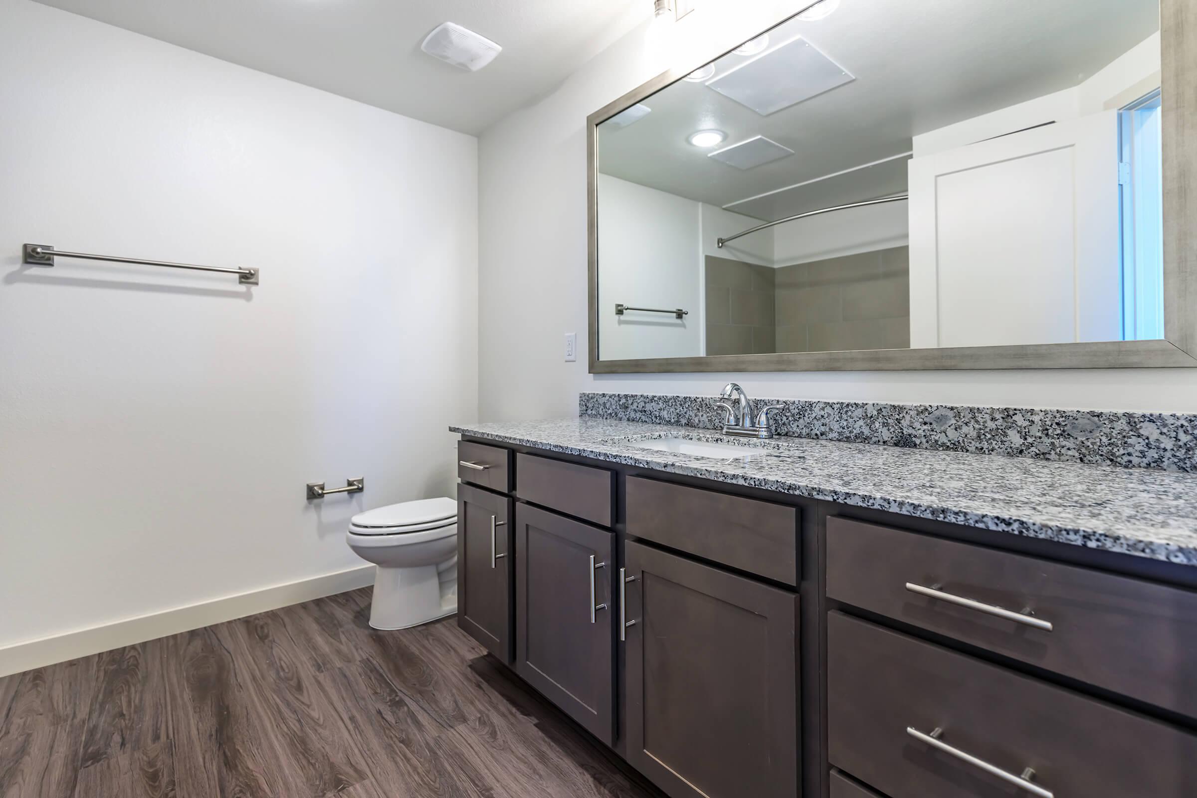 a kitchen with a sink and a mirror