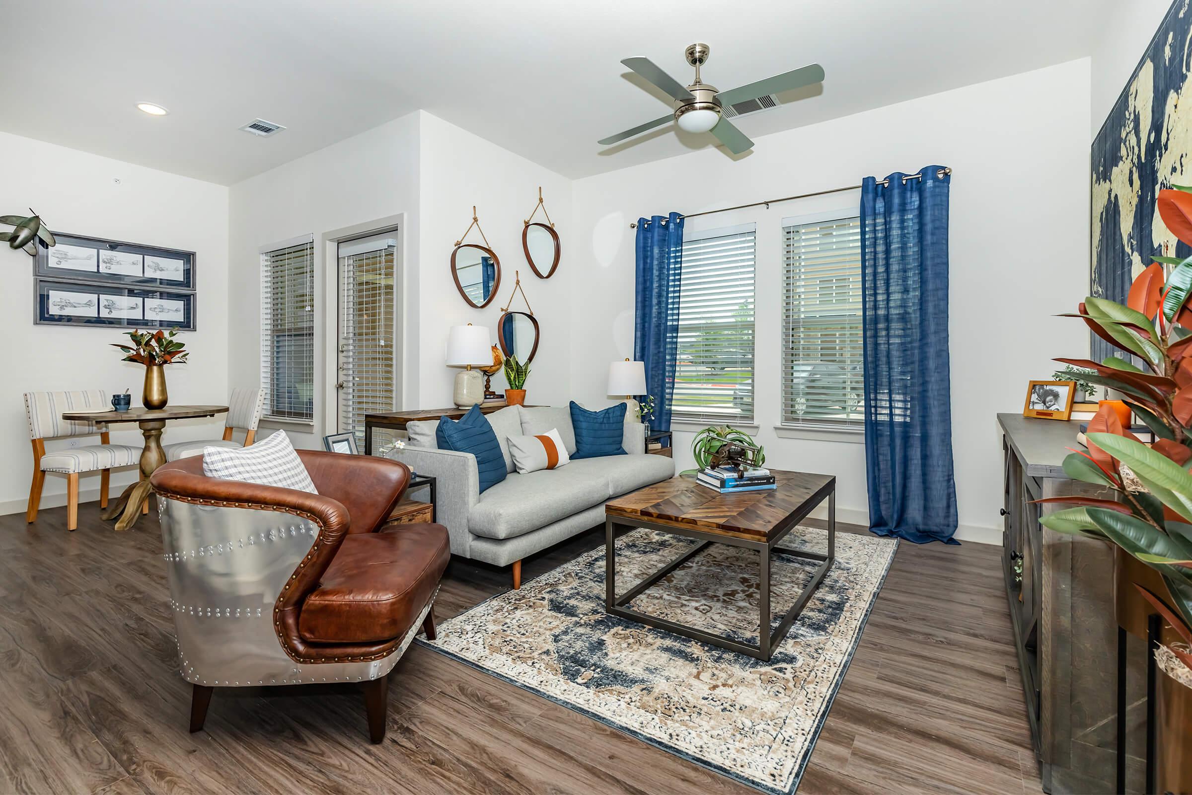 a living room filled with furniture and a flat screen tv