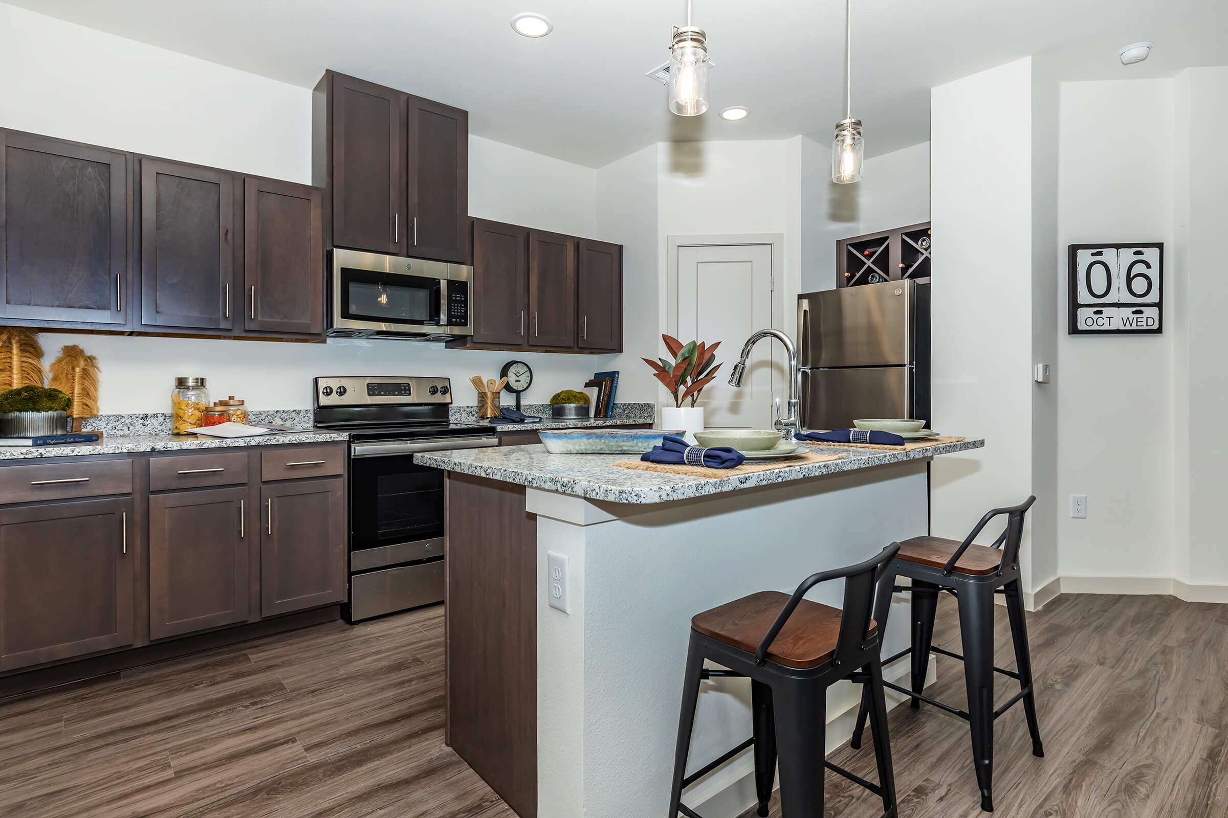 a large kitchen with stainless steel appliances