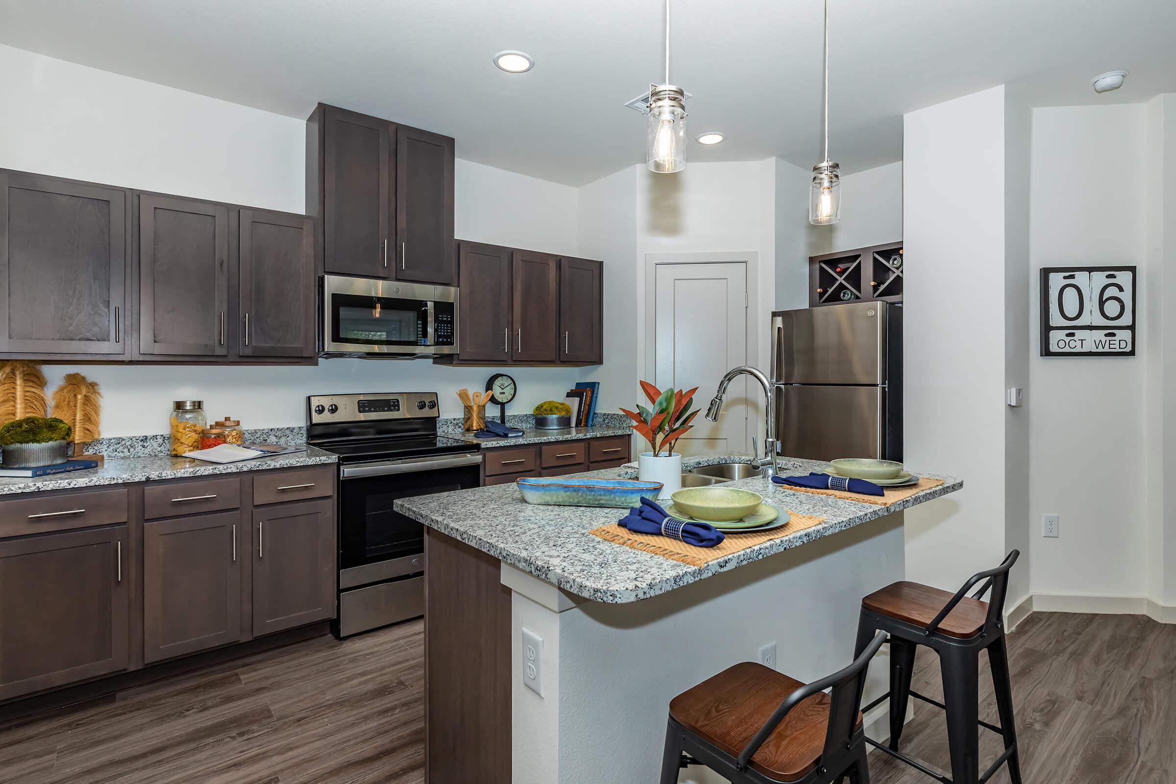 a modern kitchen with stainless steel appliances