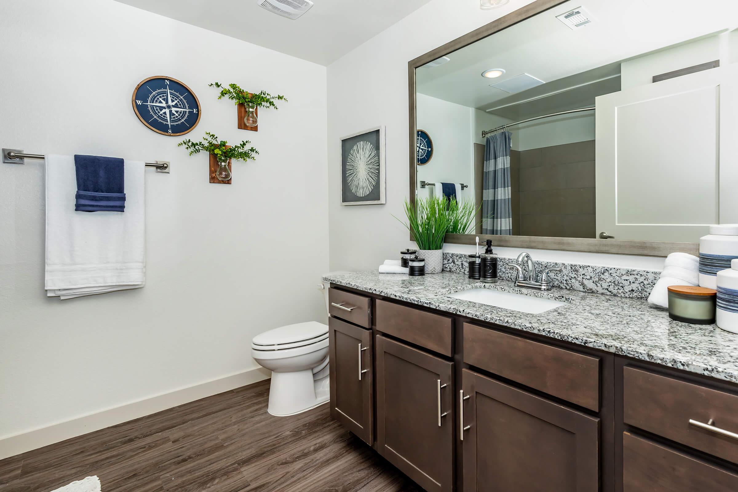 a kitchen with a sink and a mirror