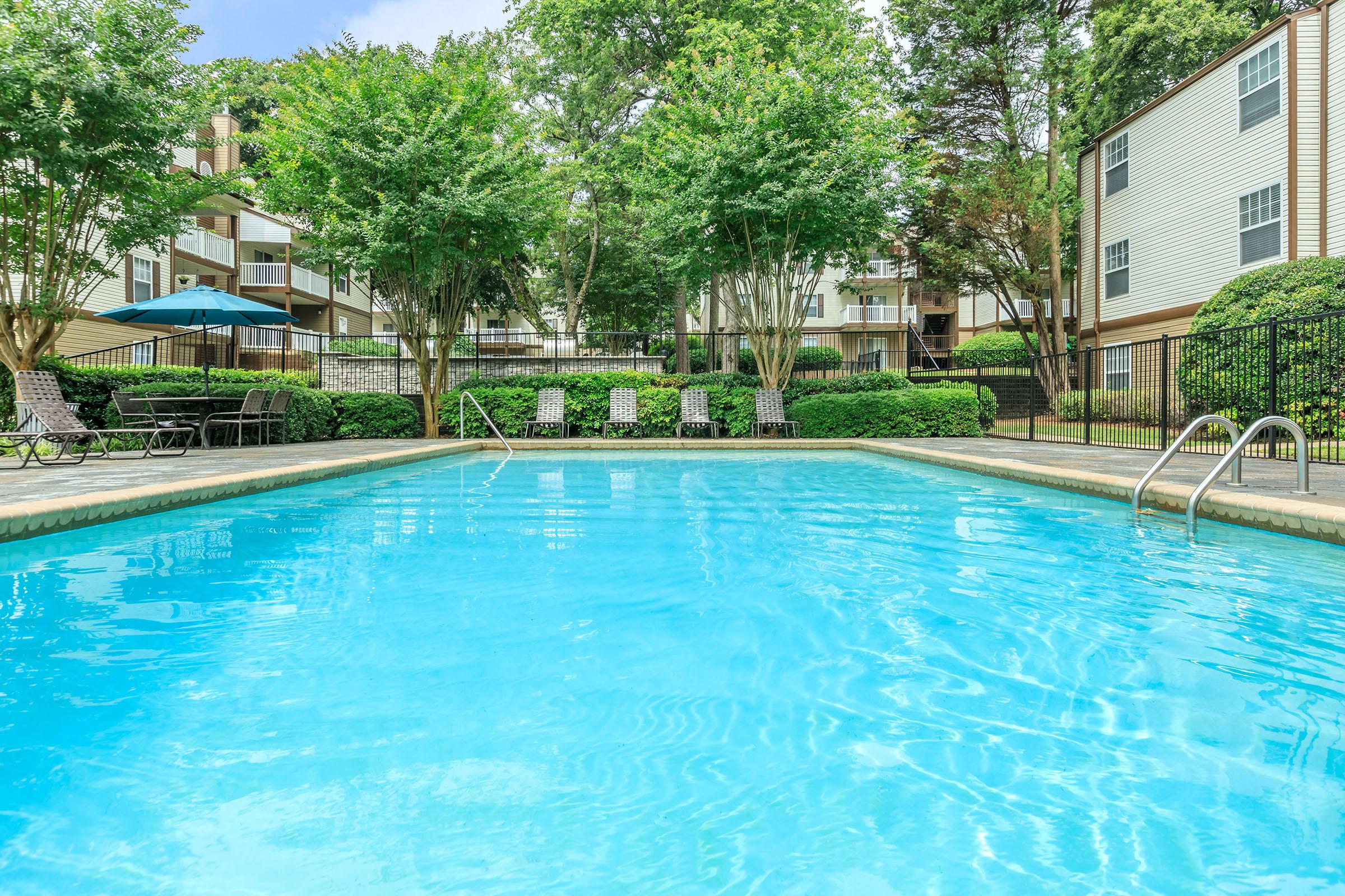 a pool next to a body of water