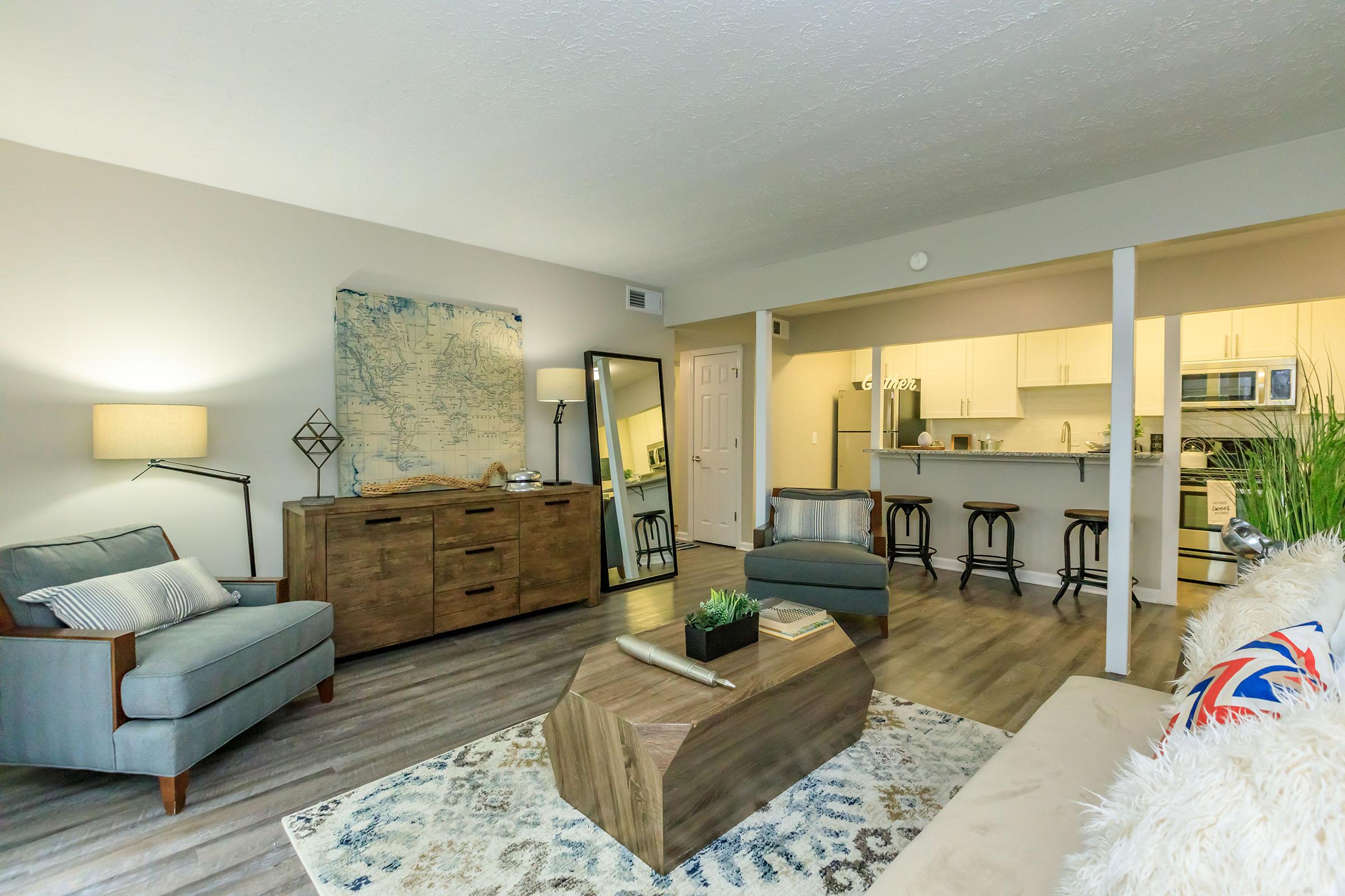 a living room filled with furniture and a fireplace