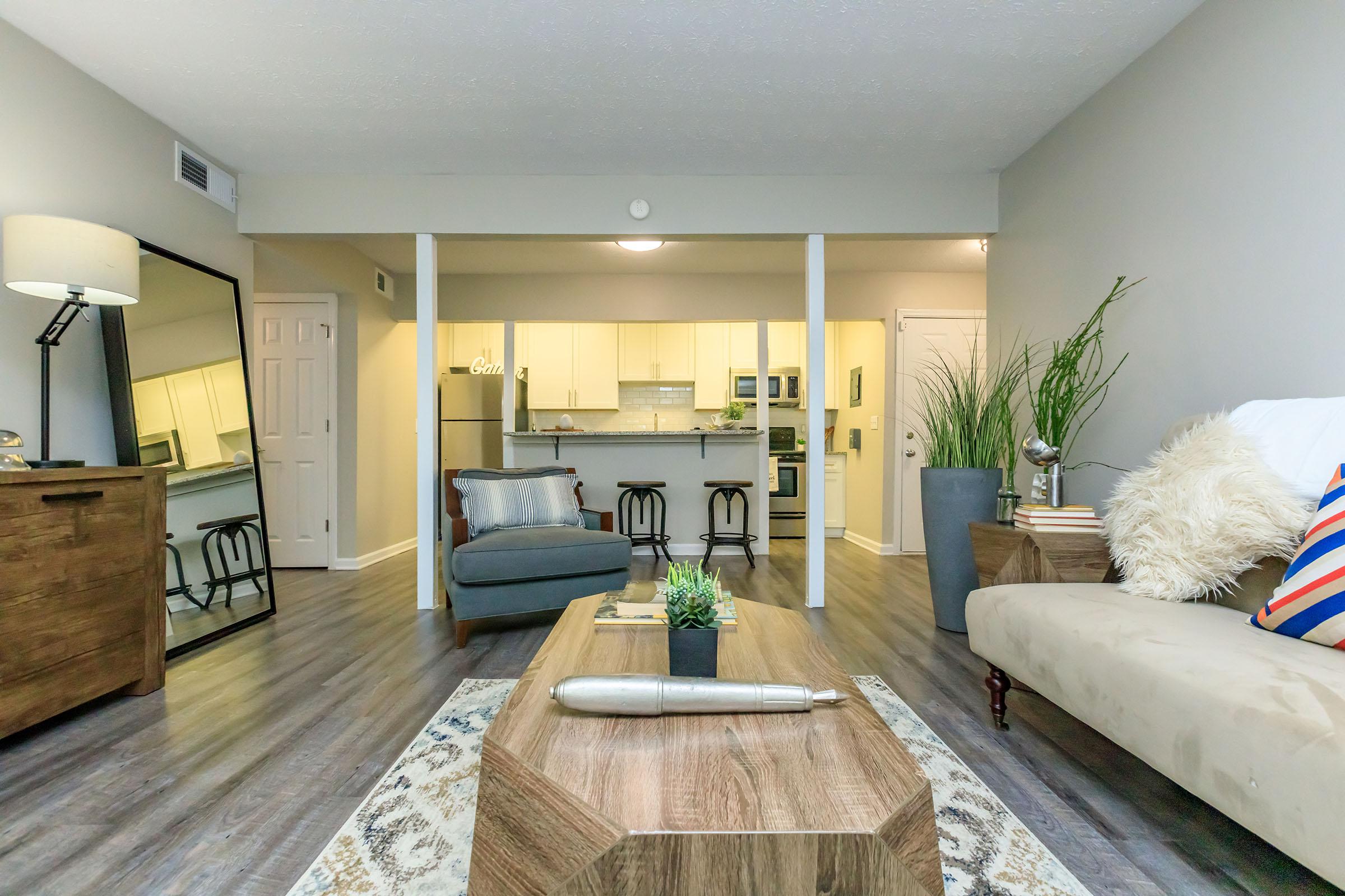 a living room filled with furniture and a fireplace