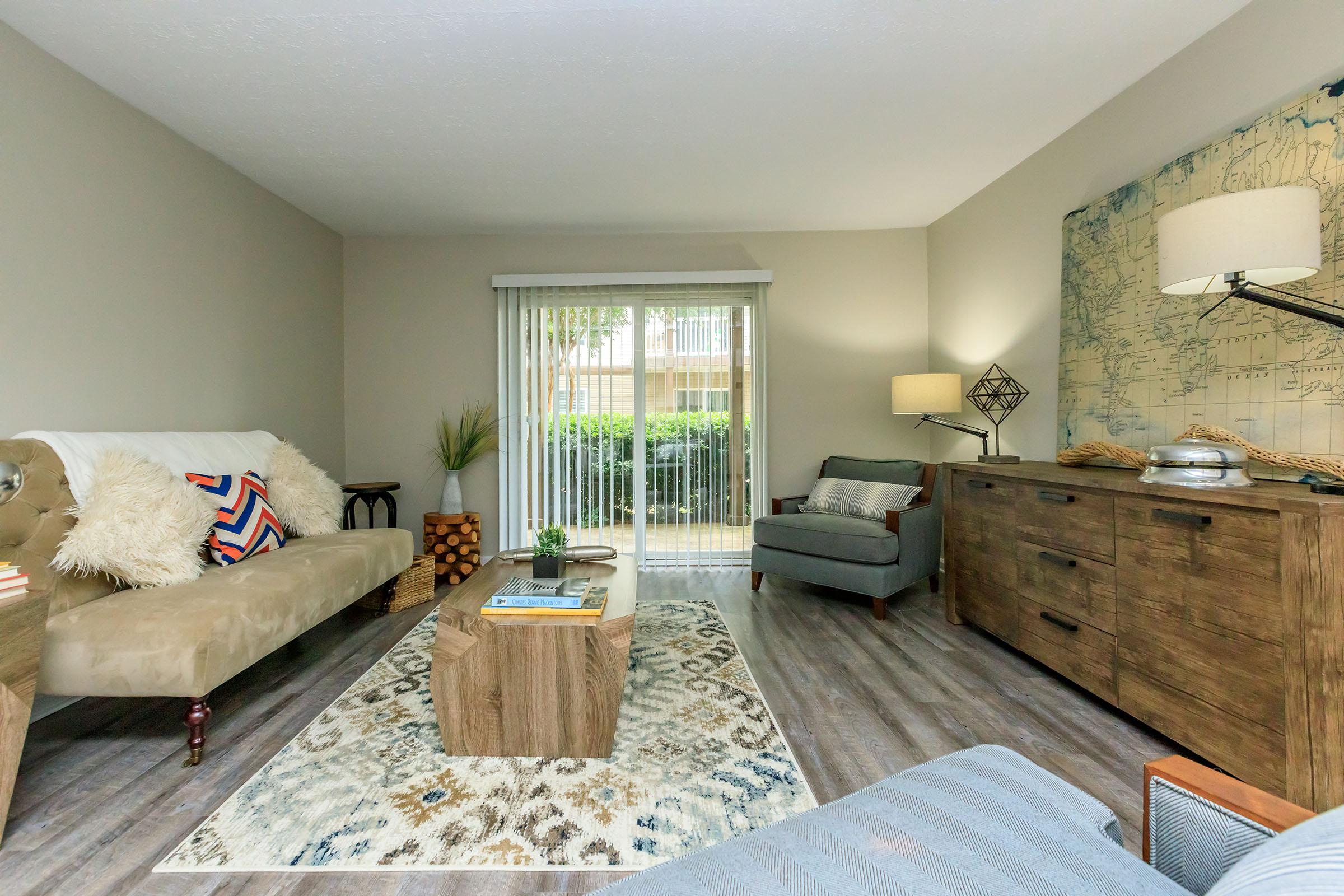 a living room filled with furniture and a fireplace