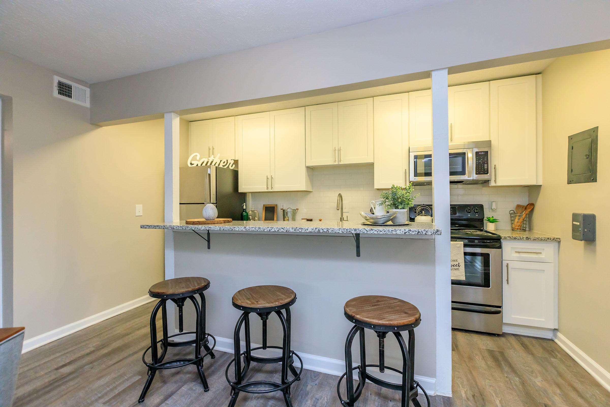 a kitchen with a dining room table