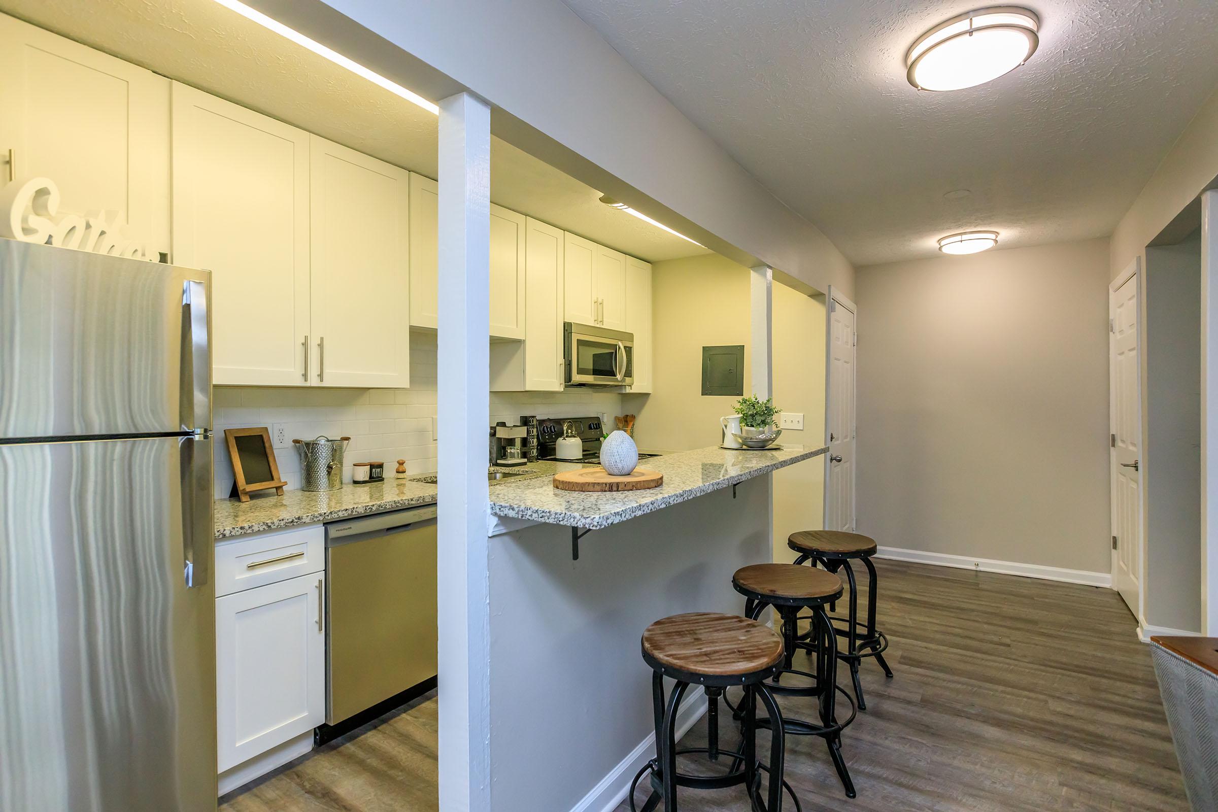 a kitchen with a table in a room