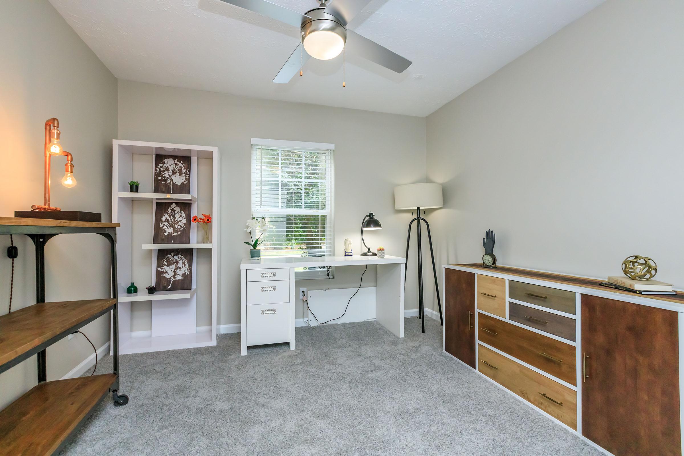 a bedroom with a wooden floor