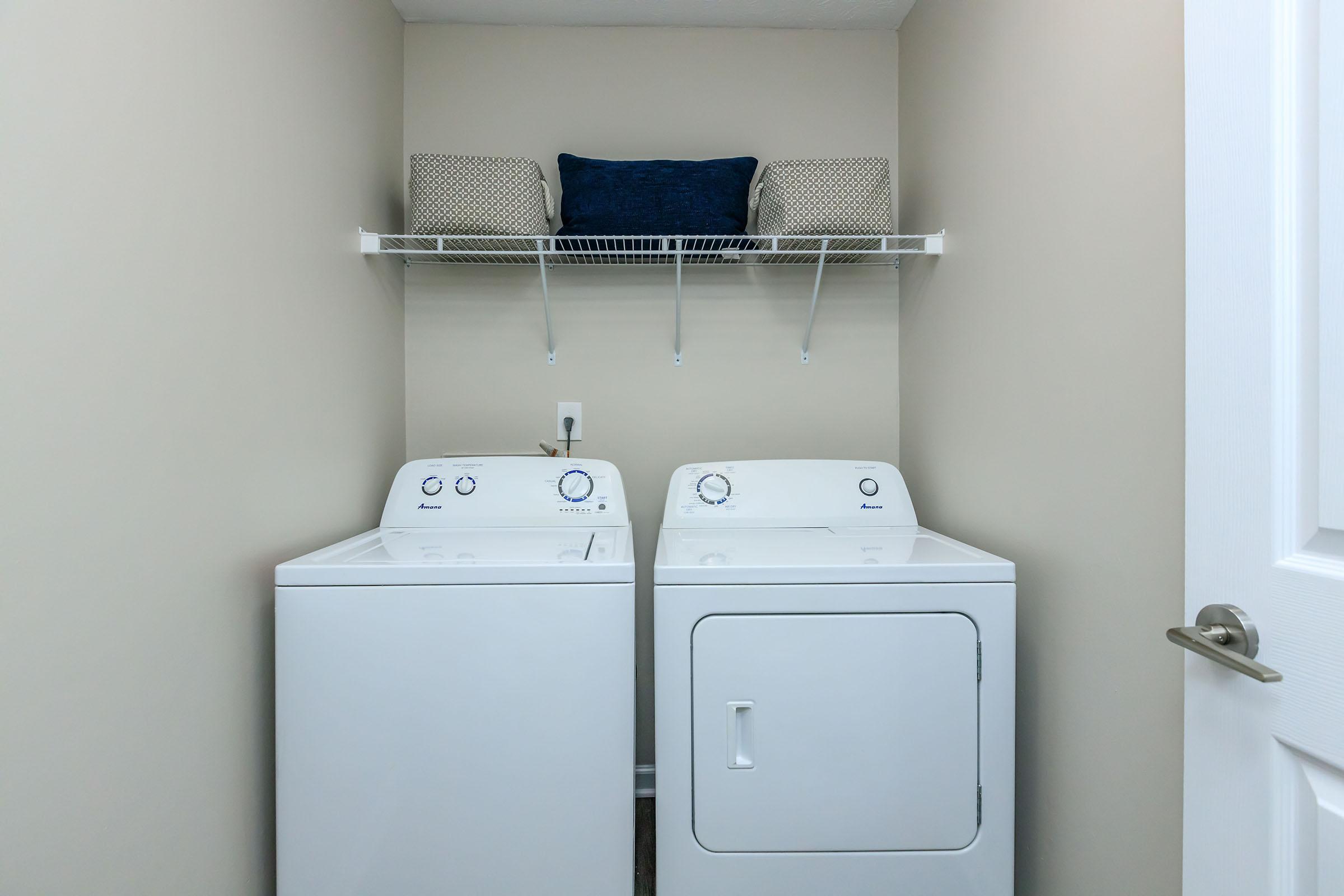 a refrigerator freezer sitting next to a sink