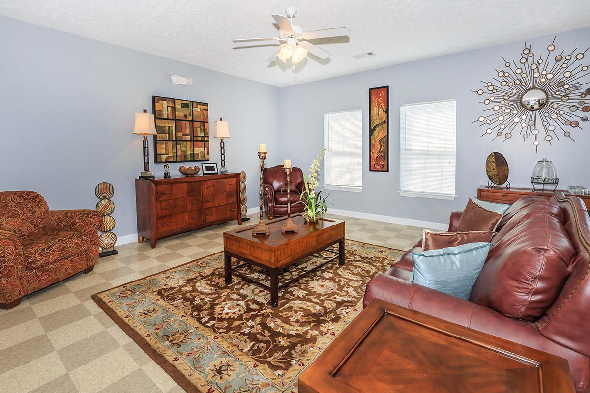 a living room filled with furniture and a fireplace