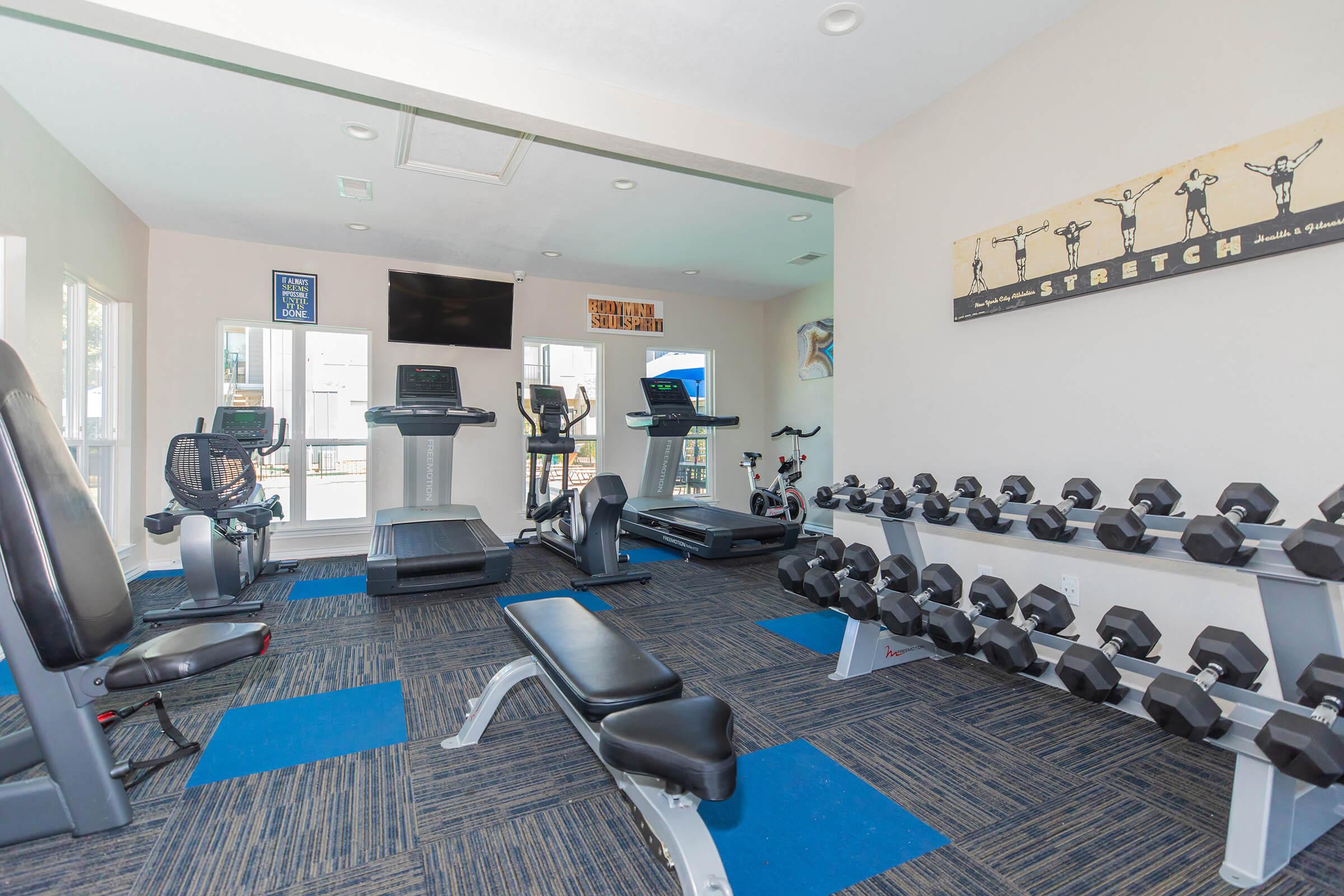 a room filled with furniture and a flat screen tv