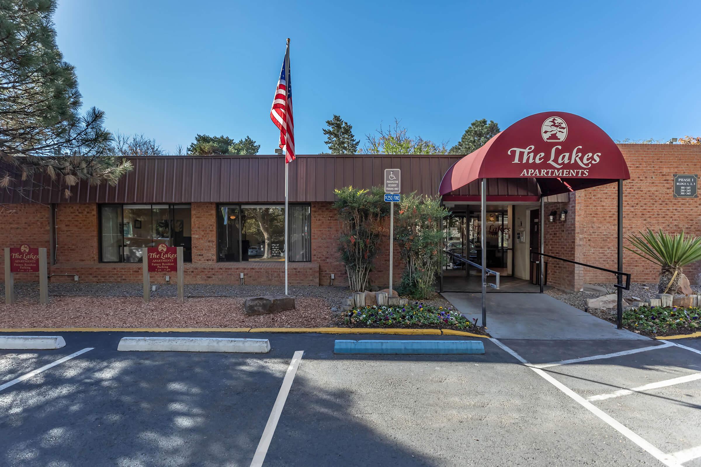 The Lakes leasing office with a red awning