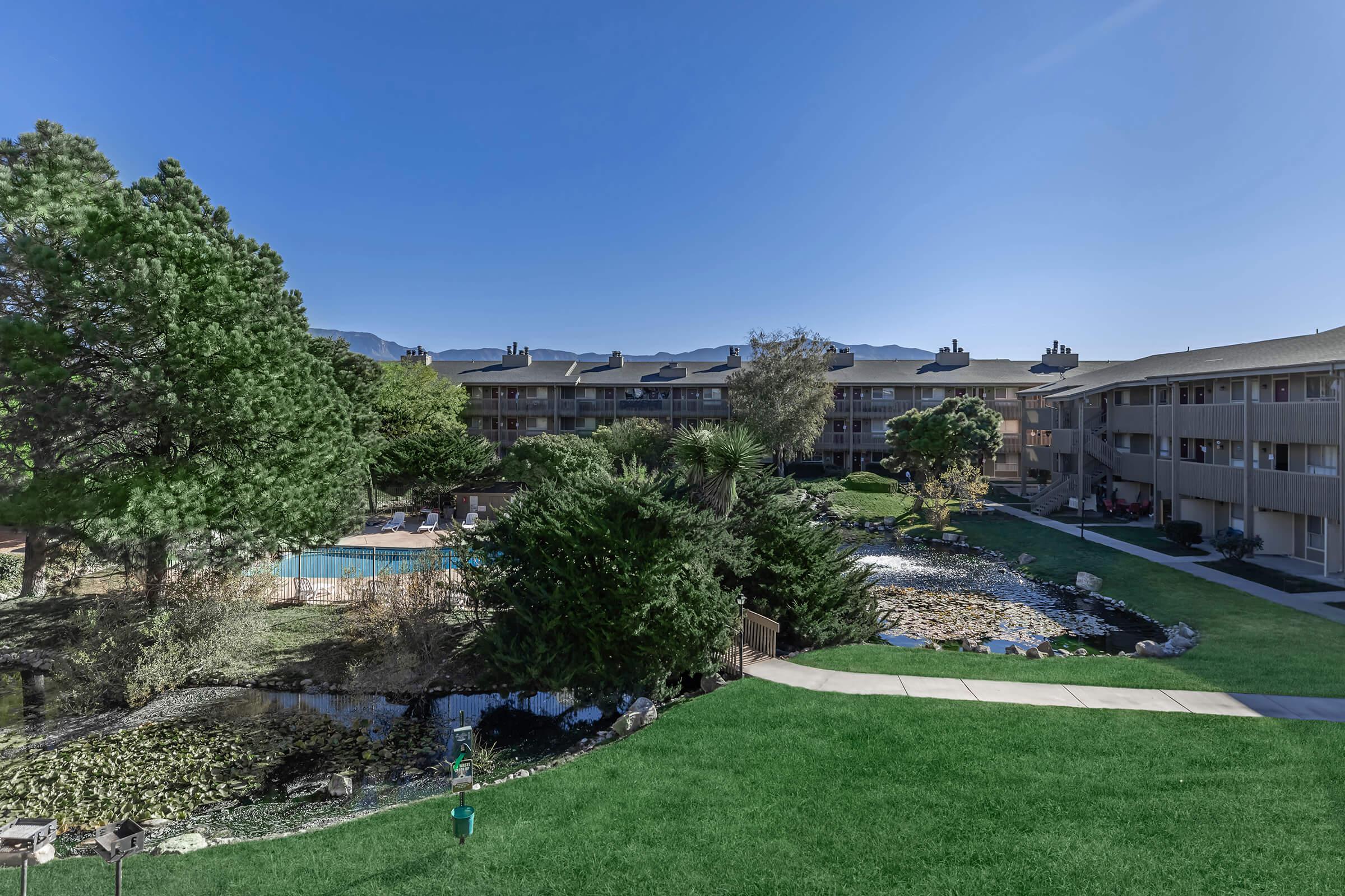 The Lakes community building with green grass