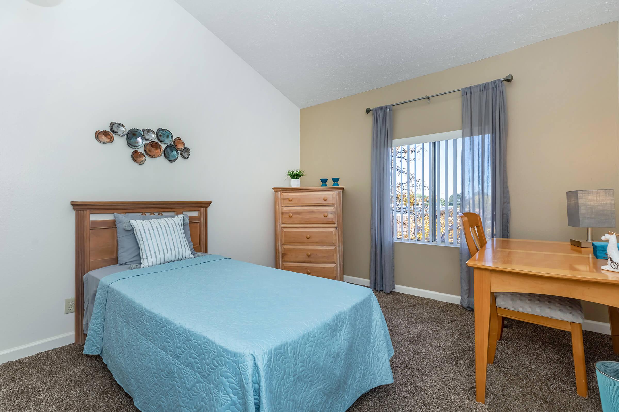 bedroom with blue bedding