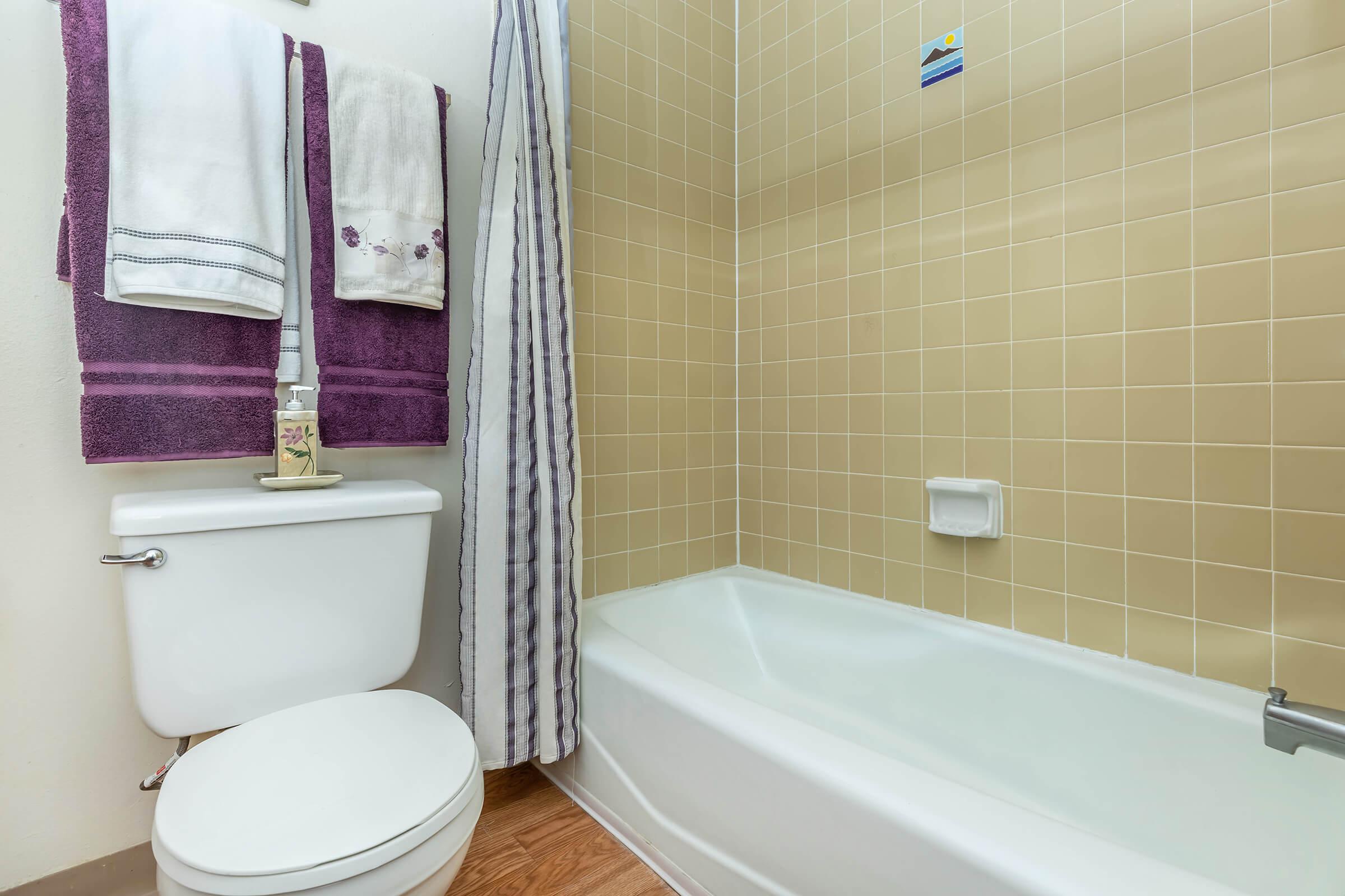 bathroom with purple towels