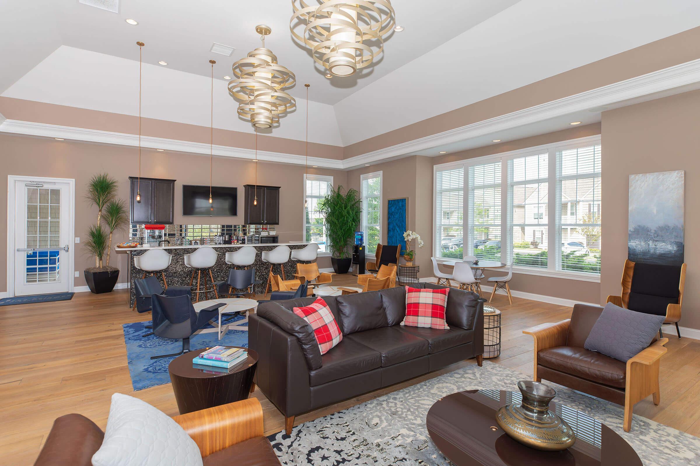 a living room filled with furniture and a large window