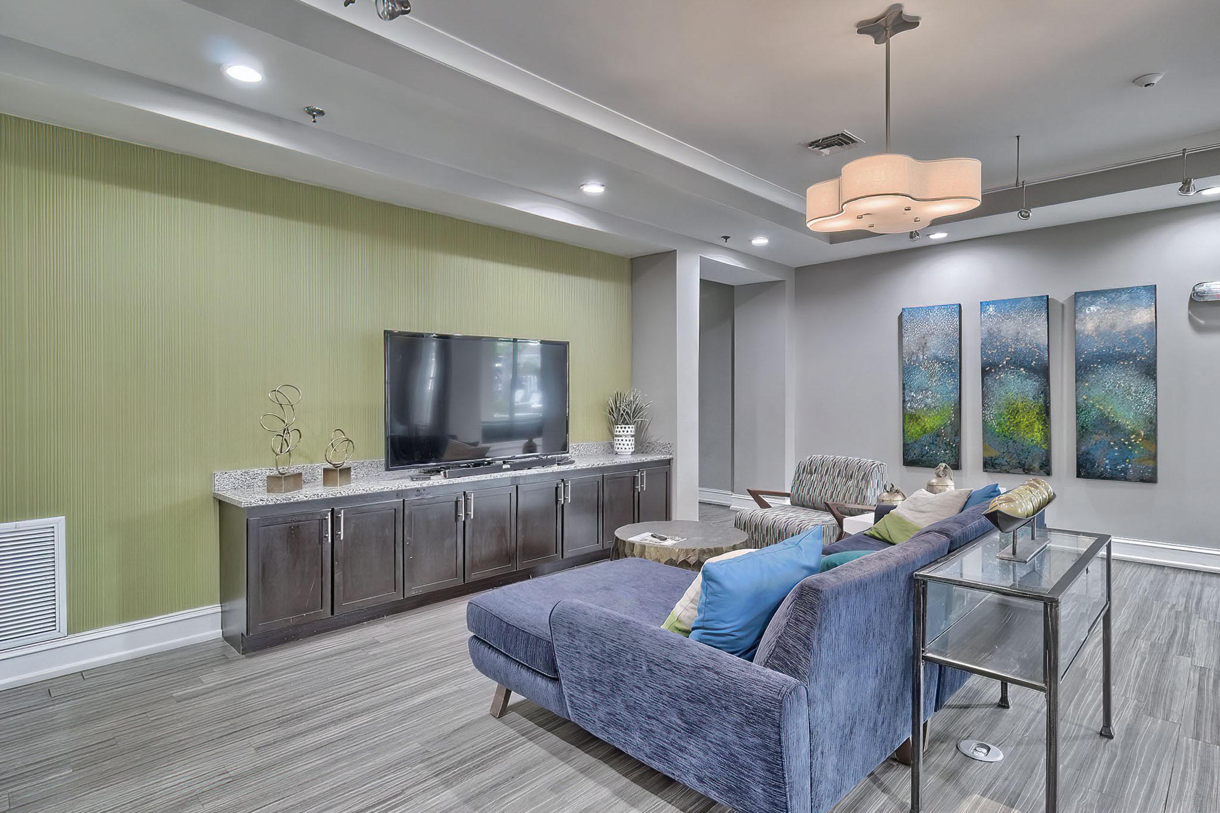 a living room filled with furniture and a large window