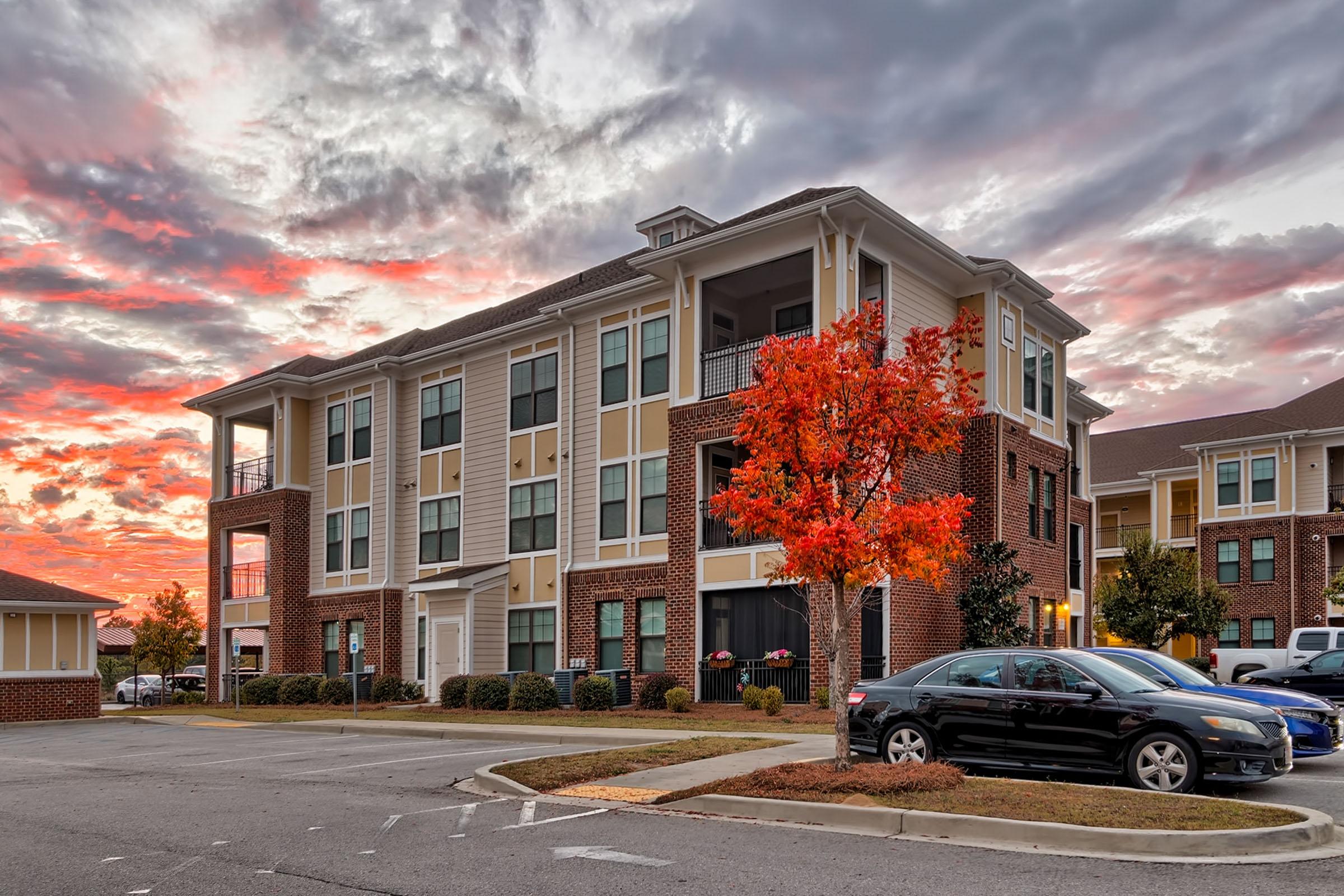 a car parked in front of a brick building