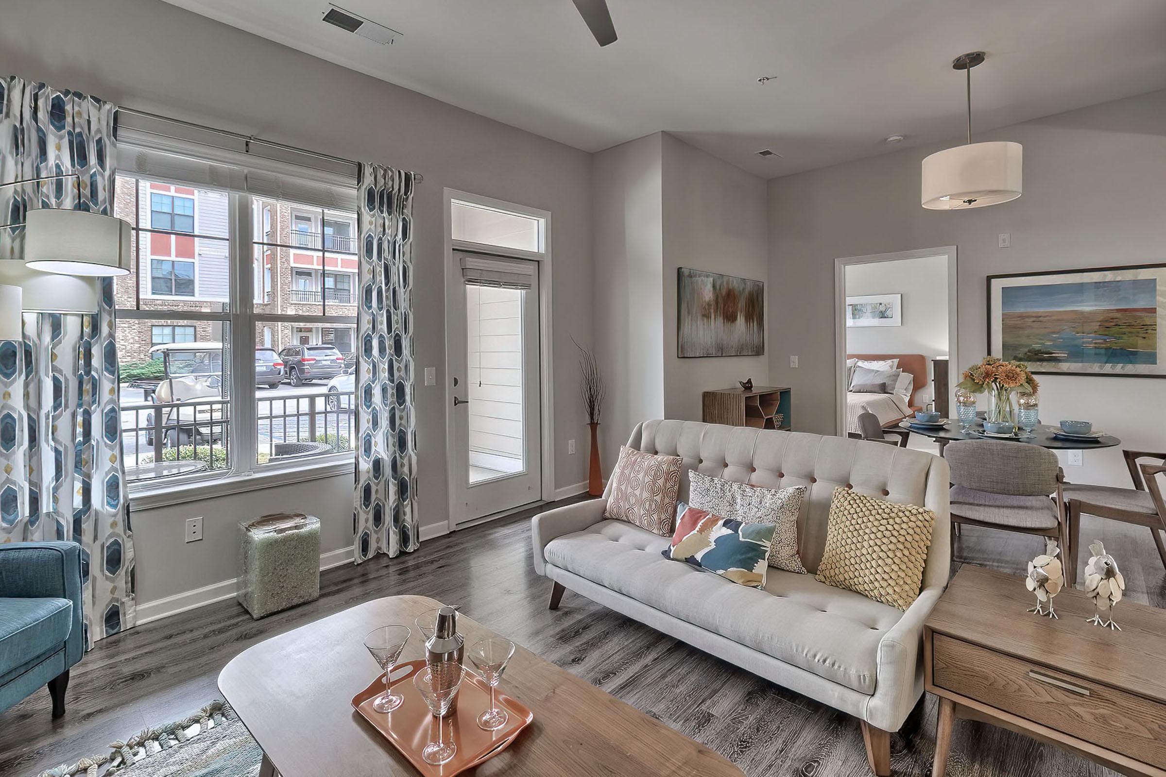 a living room with a sink and a window