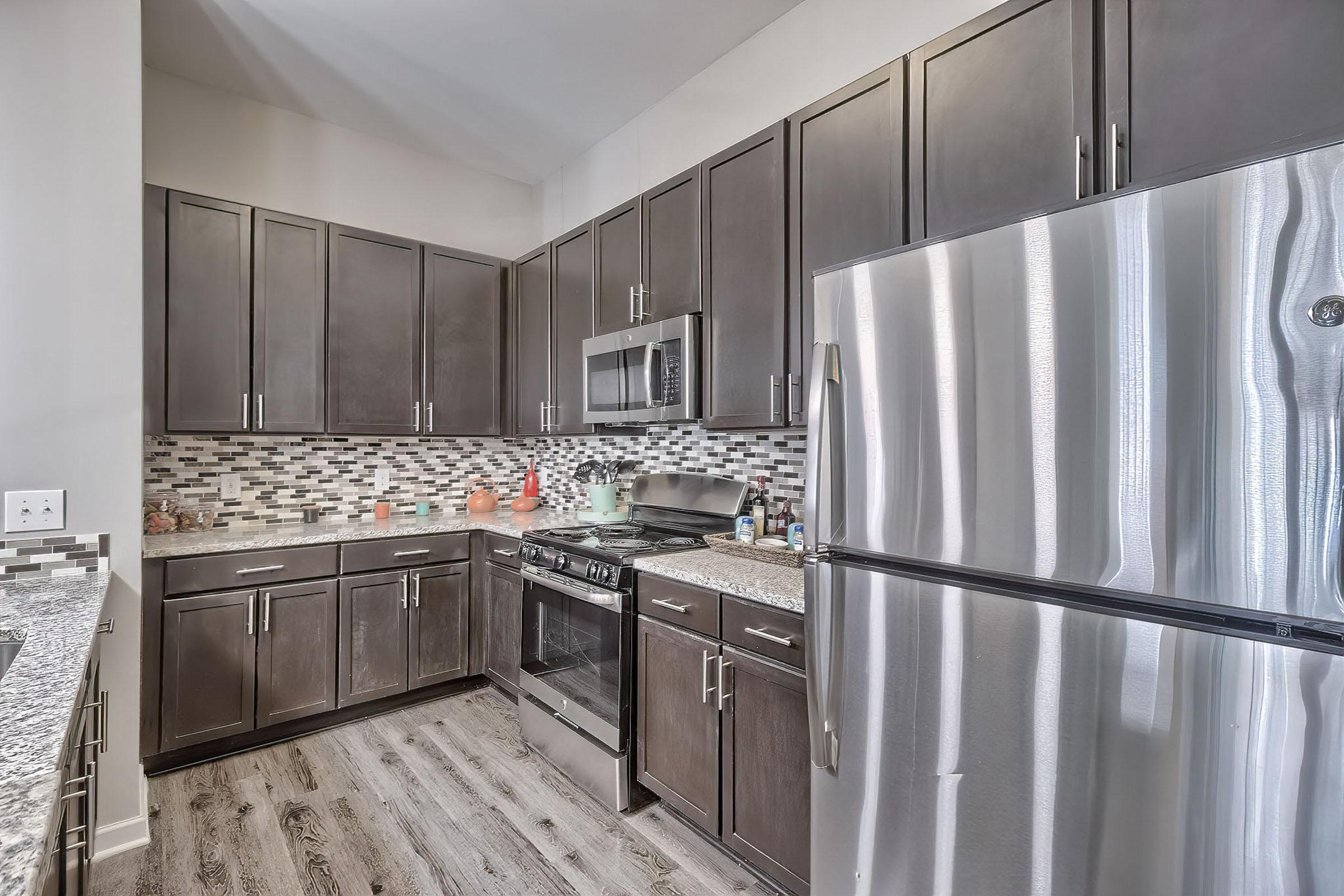 a large kitchen with stainless steel appliances