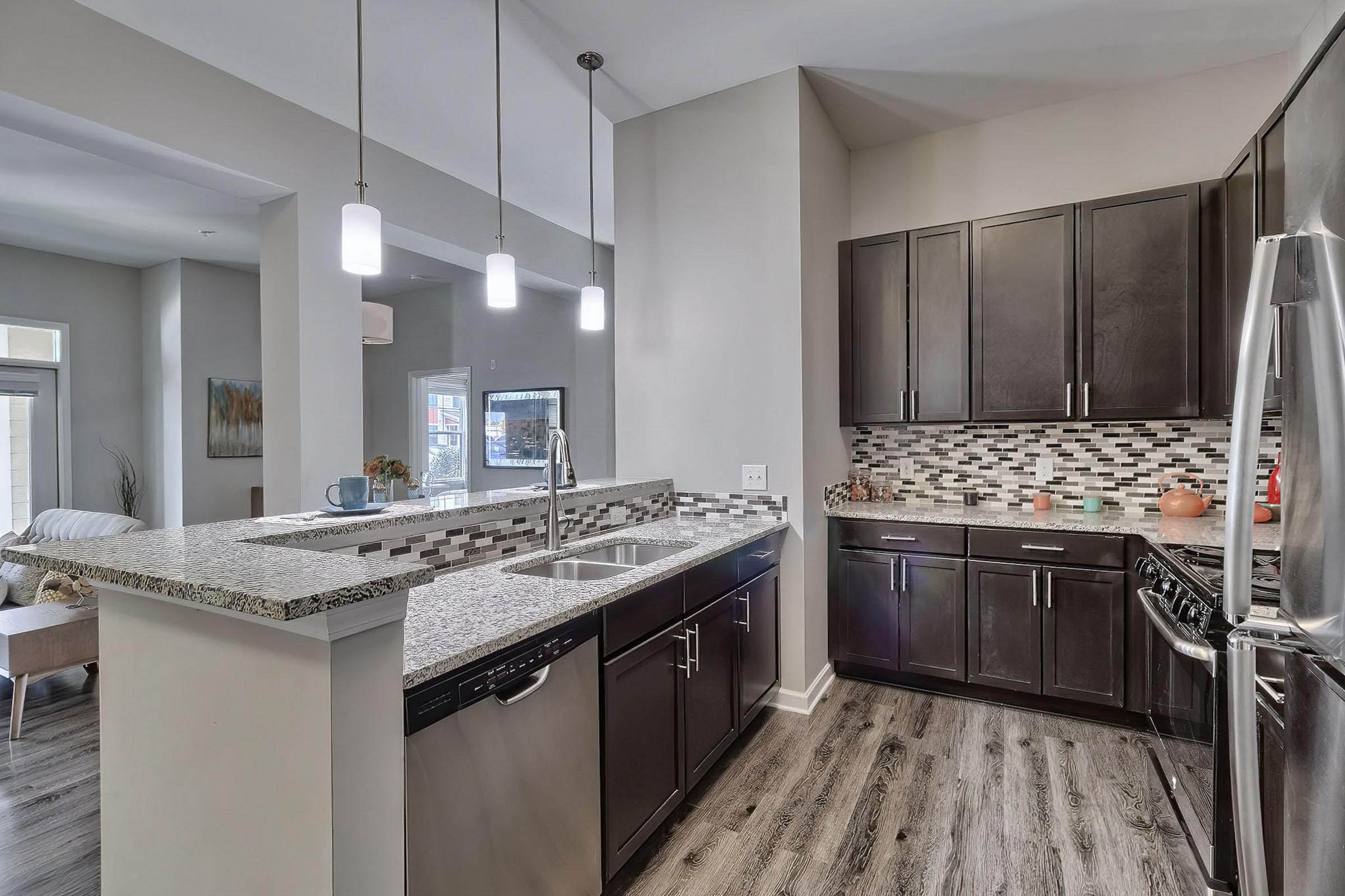 a large kitchen with stainless steel appliances