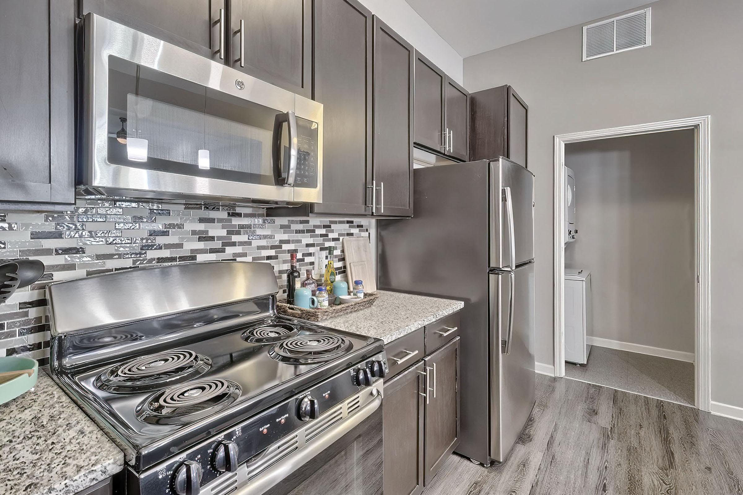 a large kitchen with stainless steel appliances