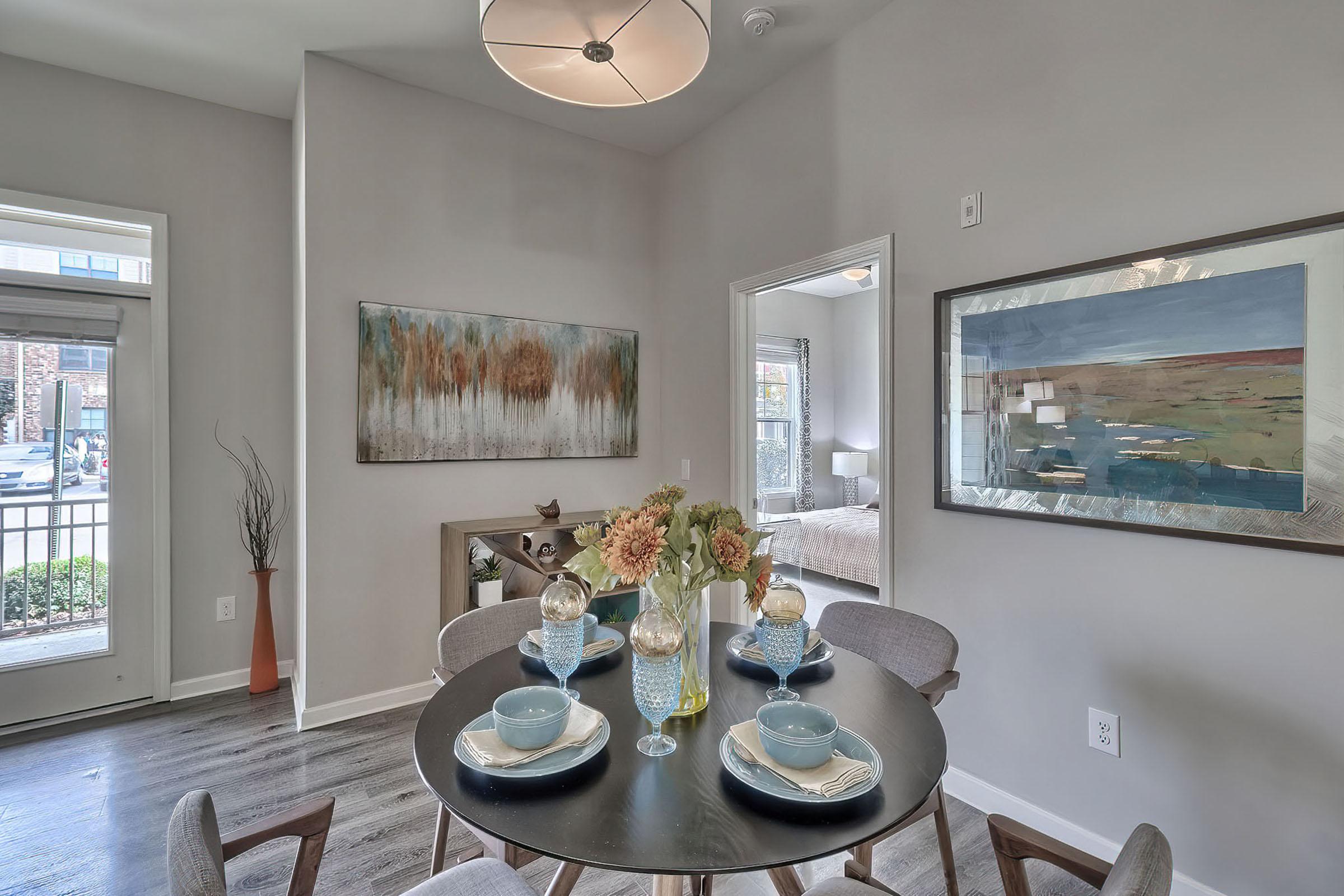 a dining room table in front of a window