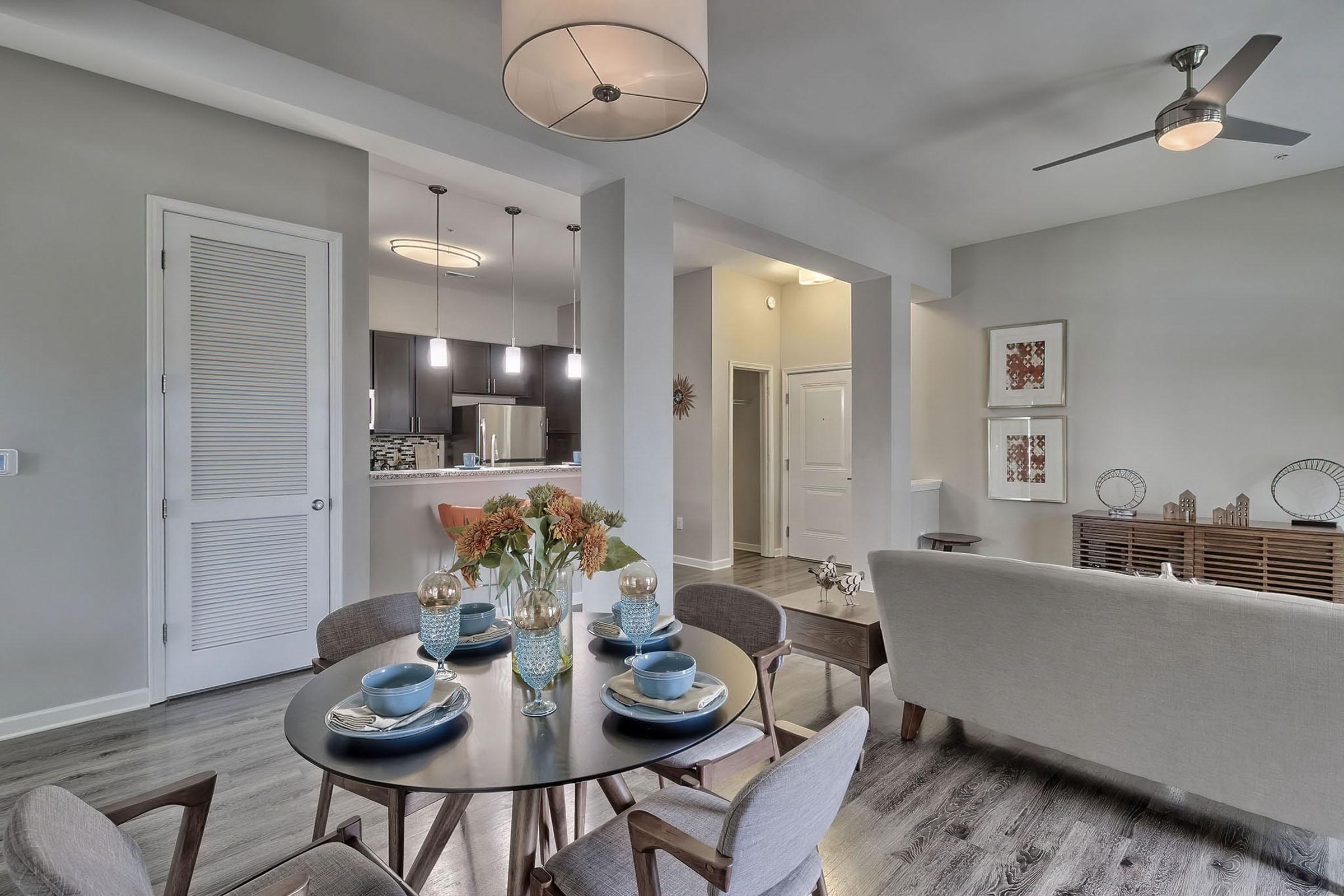 a room filled with furniture and vase on a table