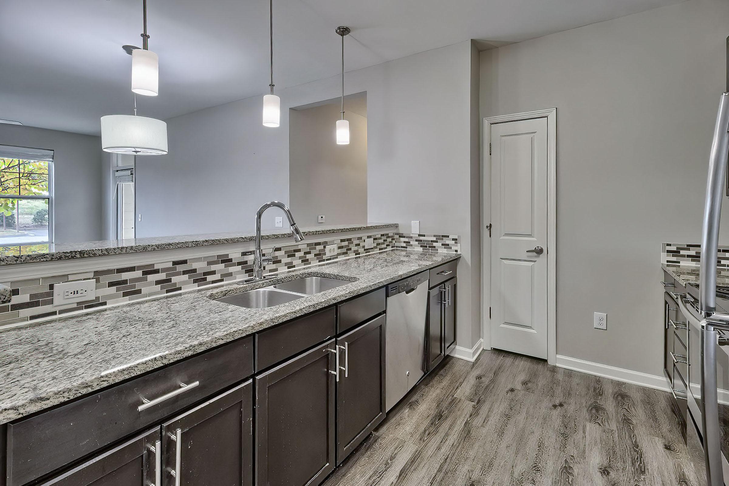 a large kitchen with stainless steel appliances