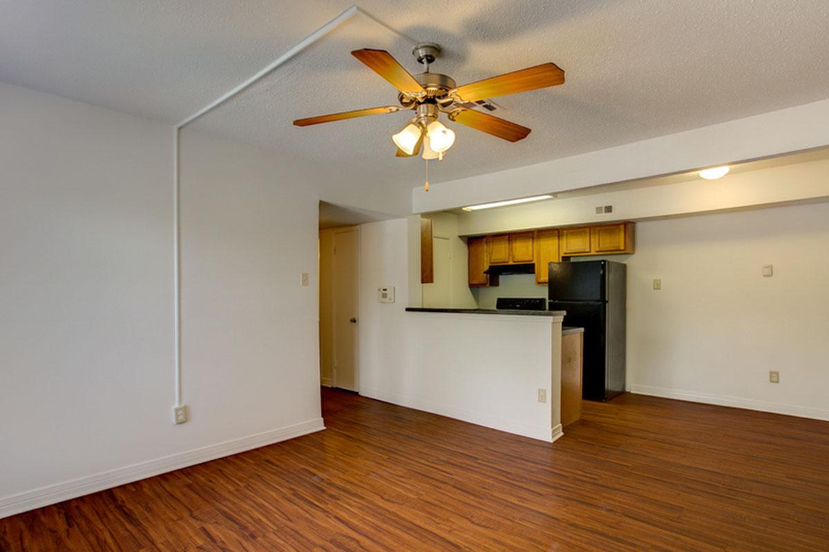 a kitchen with a hard wood floor
