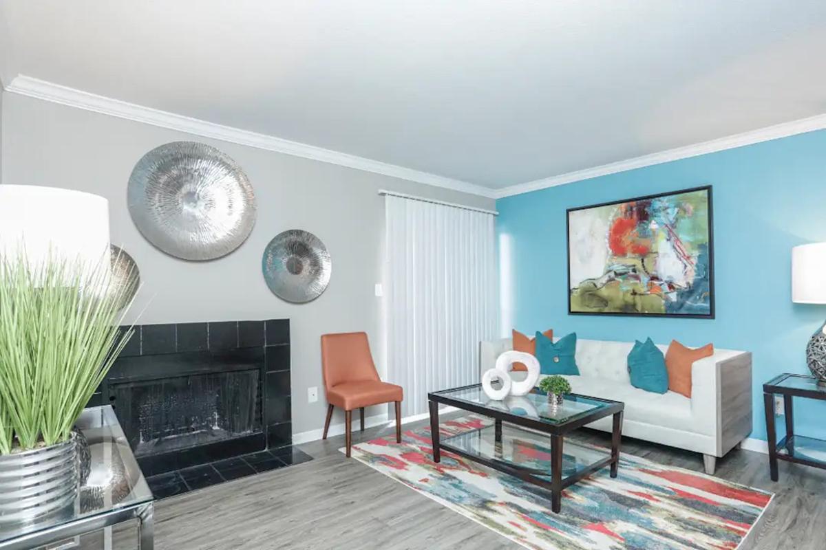 a living room filled with furniture and a flat screen tv