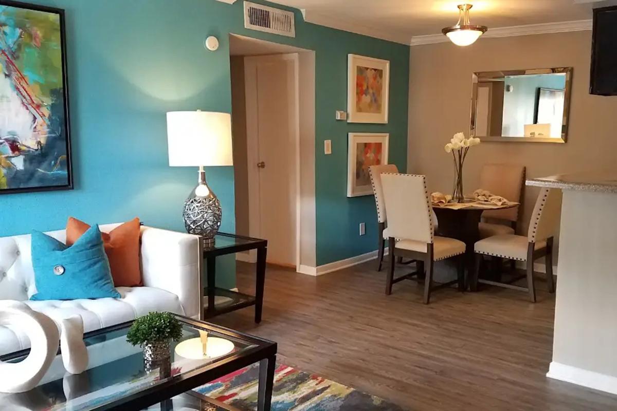 a living room filled with furniture and a fireplace