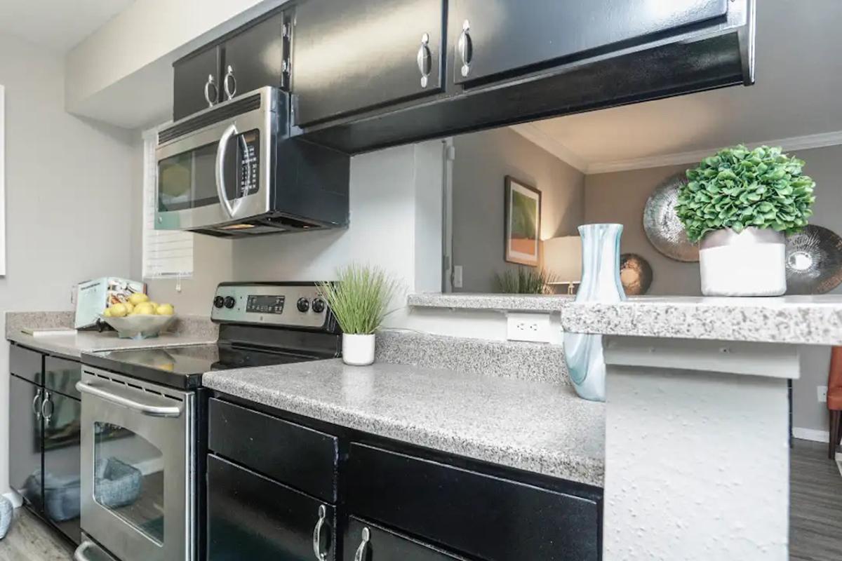 a modern kitchen with stainless steel appliances