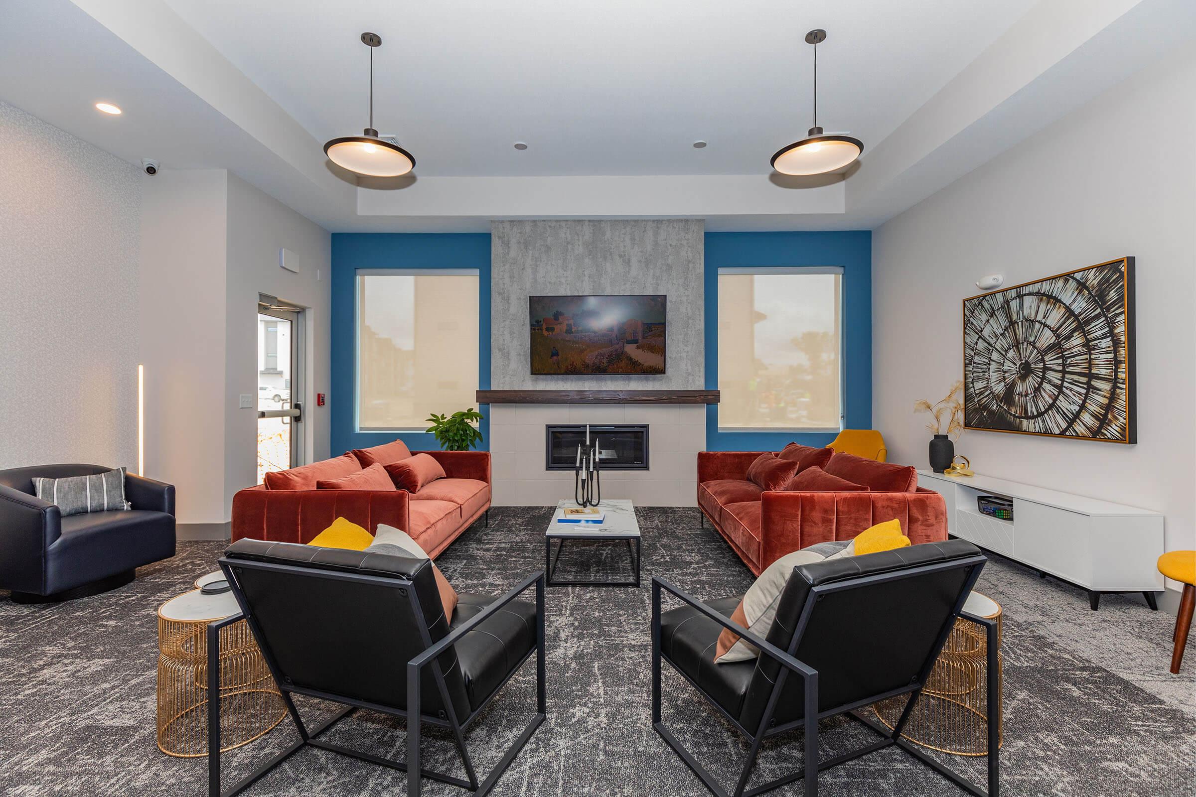 a living room filled with furniture and a fireplace