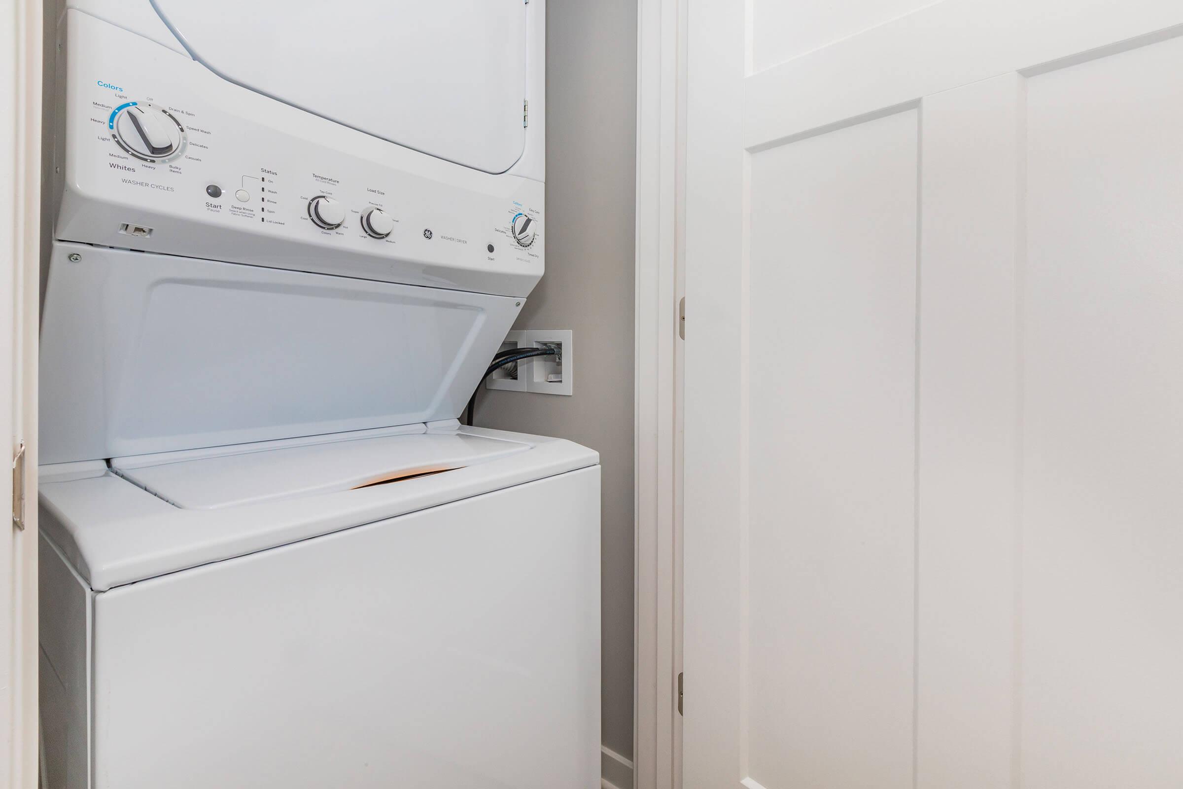 a microwave oven sitting on top of a refrigerator