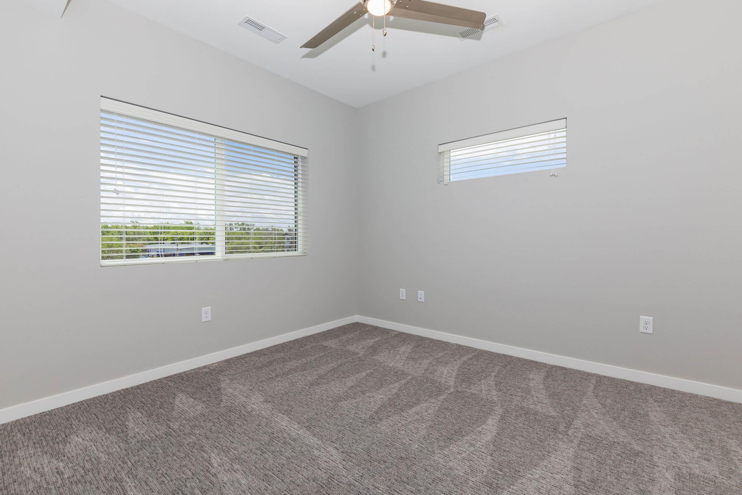 a bedroom with a large window