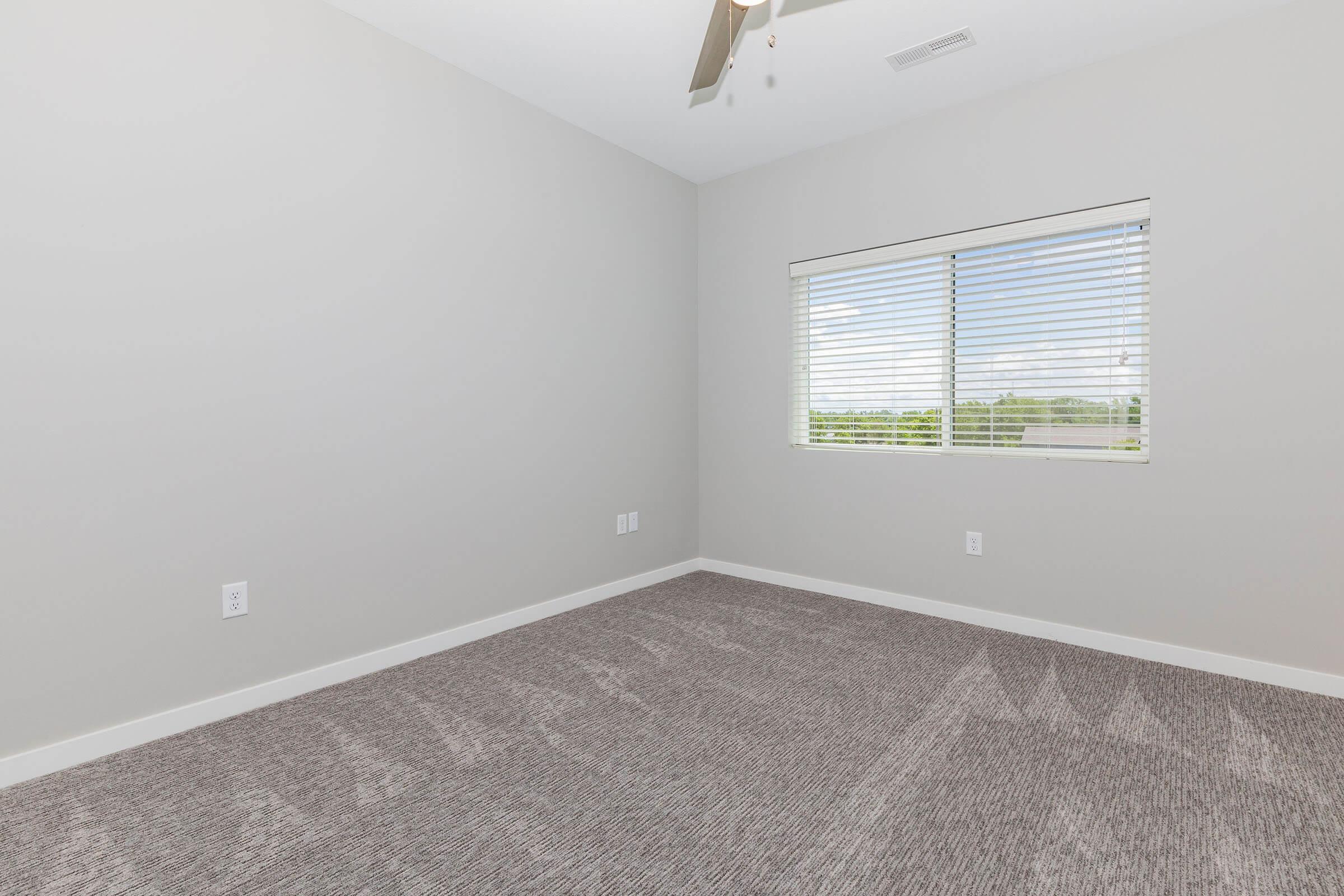 a bedroom with a large window