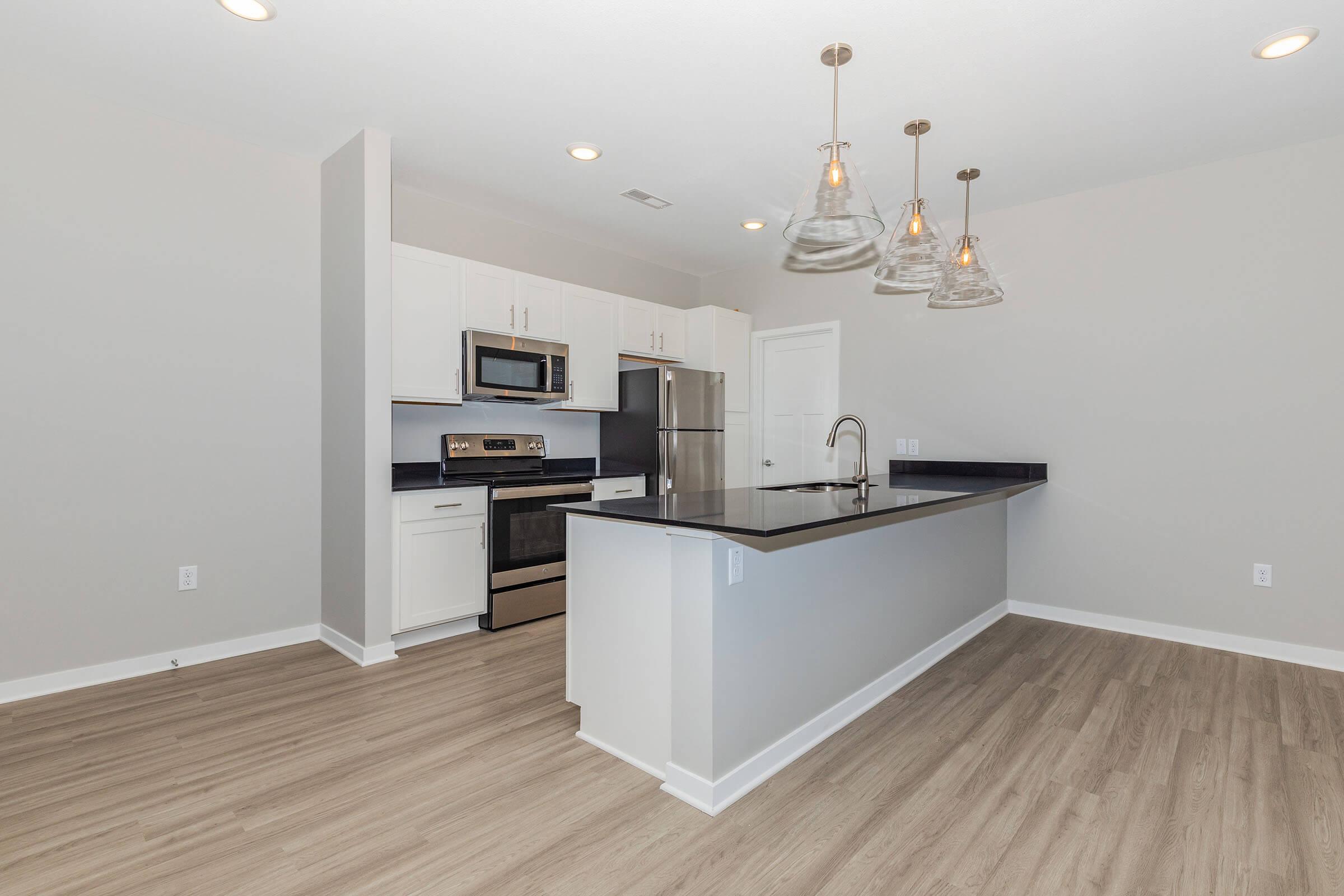 a kitchen with a wood floor