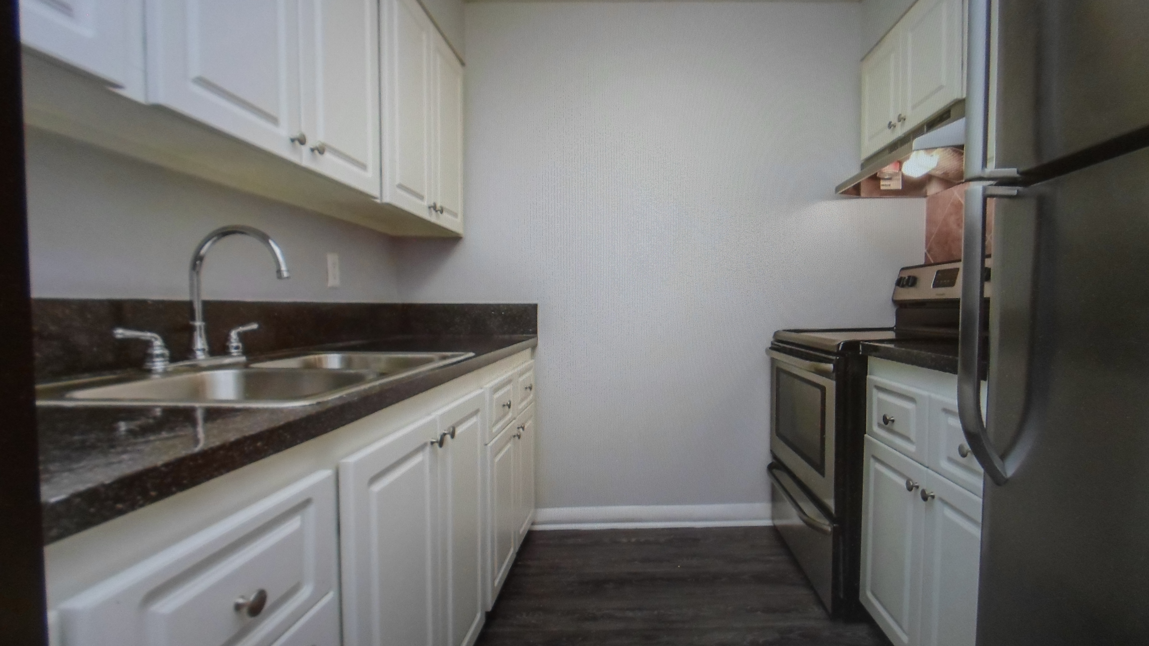 a kitchen with a stove and a sink