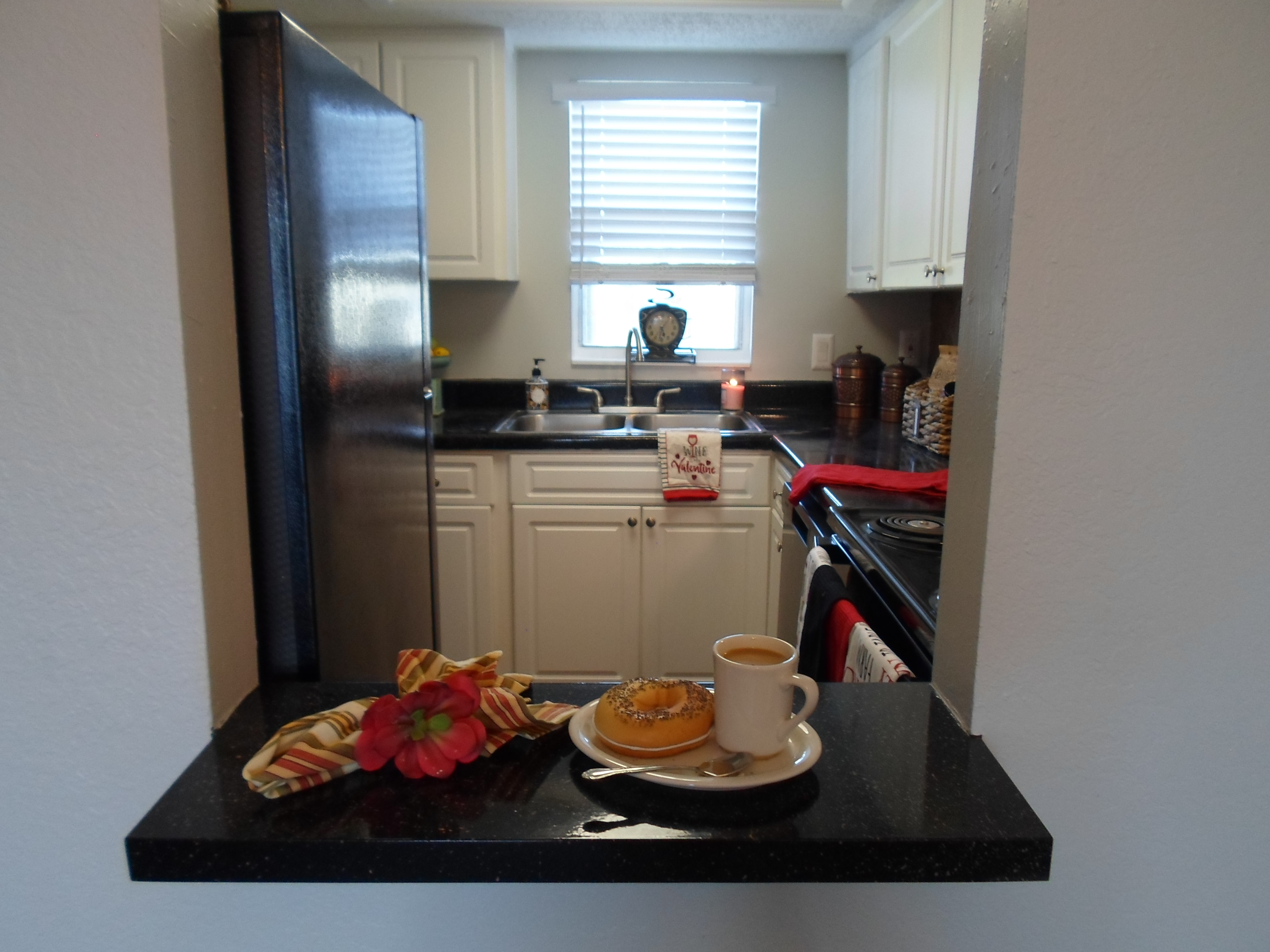 a kitchen with a sink and a window