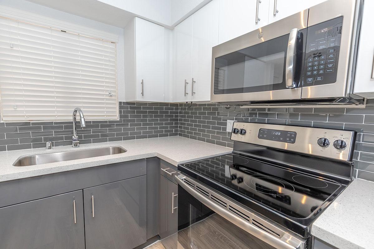 a large kitchen with stainless steel appliances