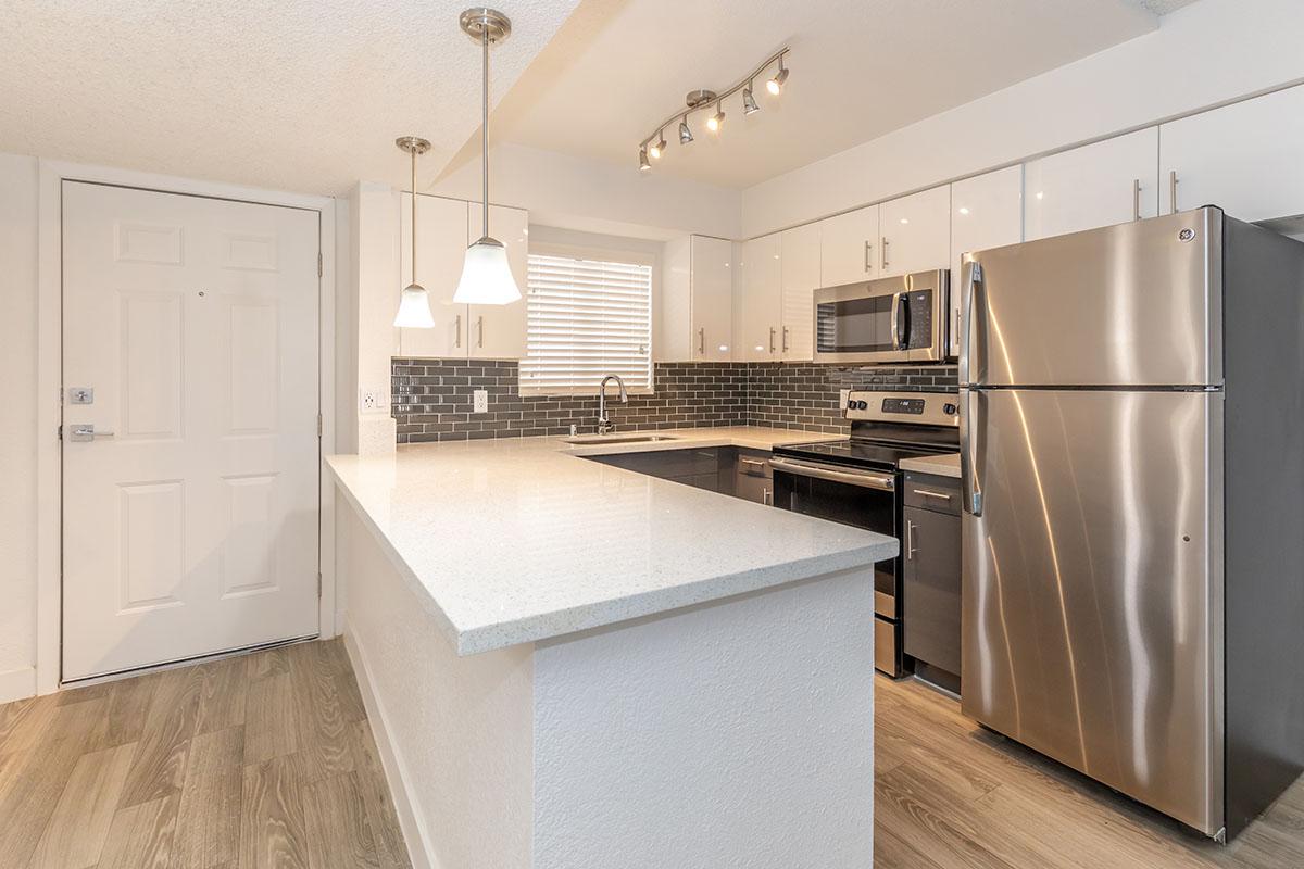 a stainless steel refrigerator in a kitchen