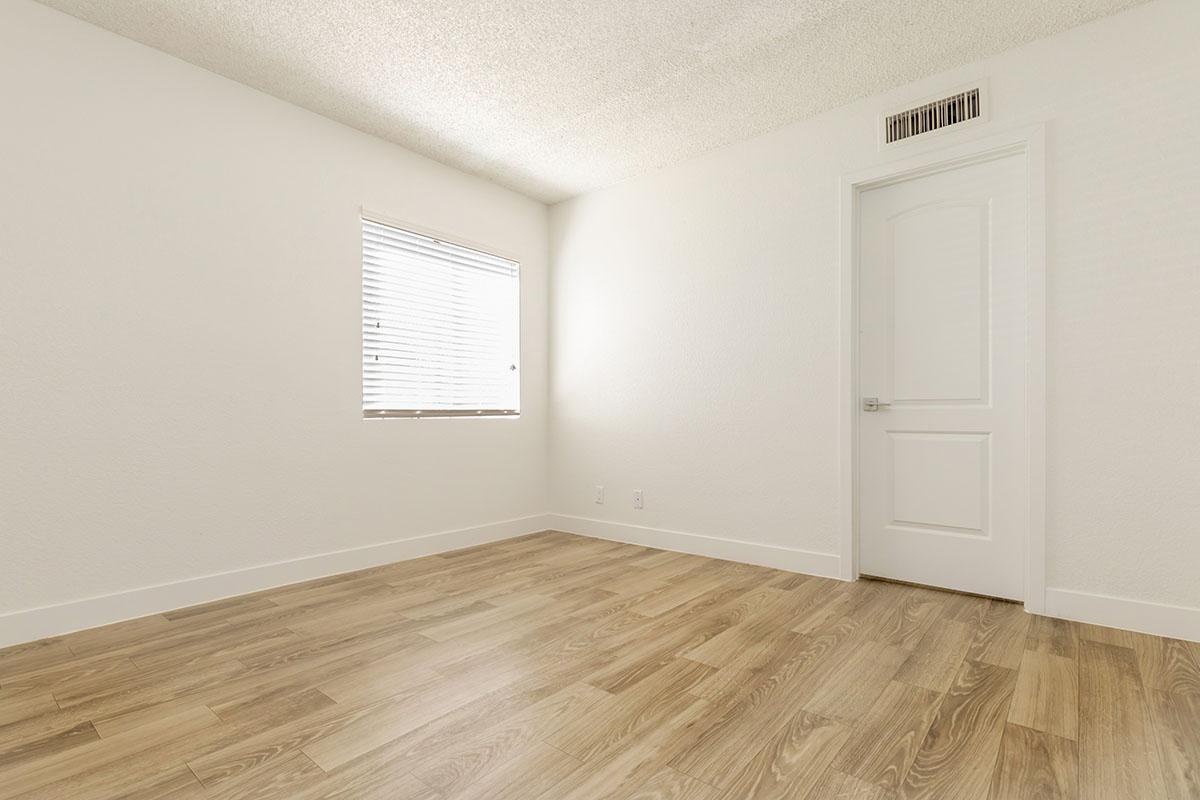 a large white building with a wooden floor