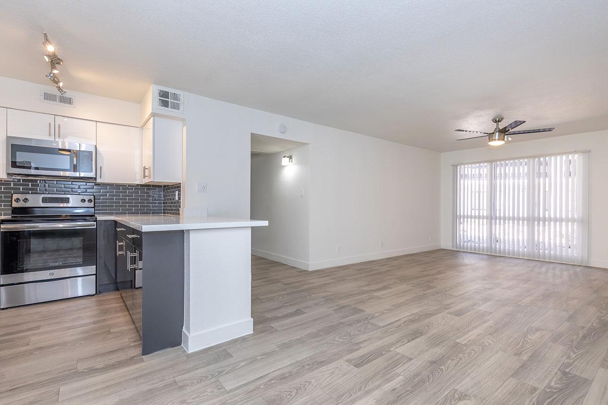 an empty kitchen and living room