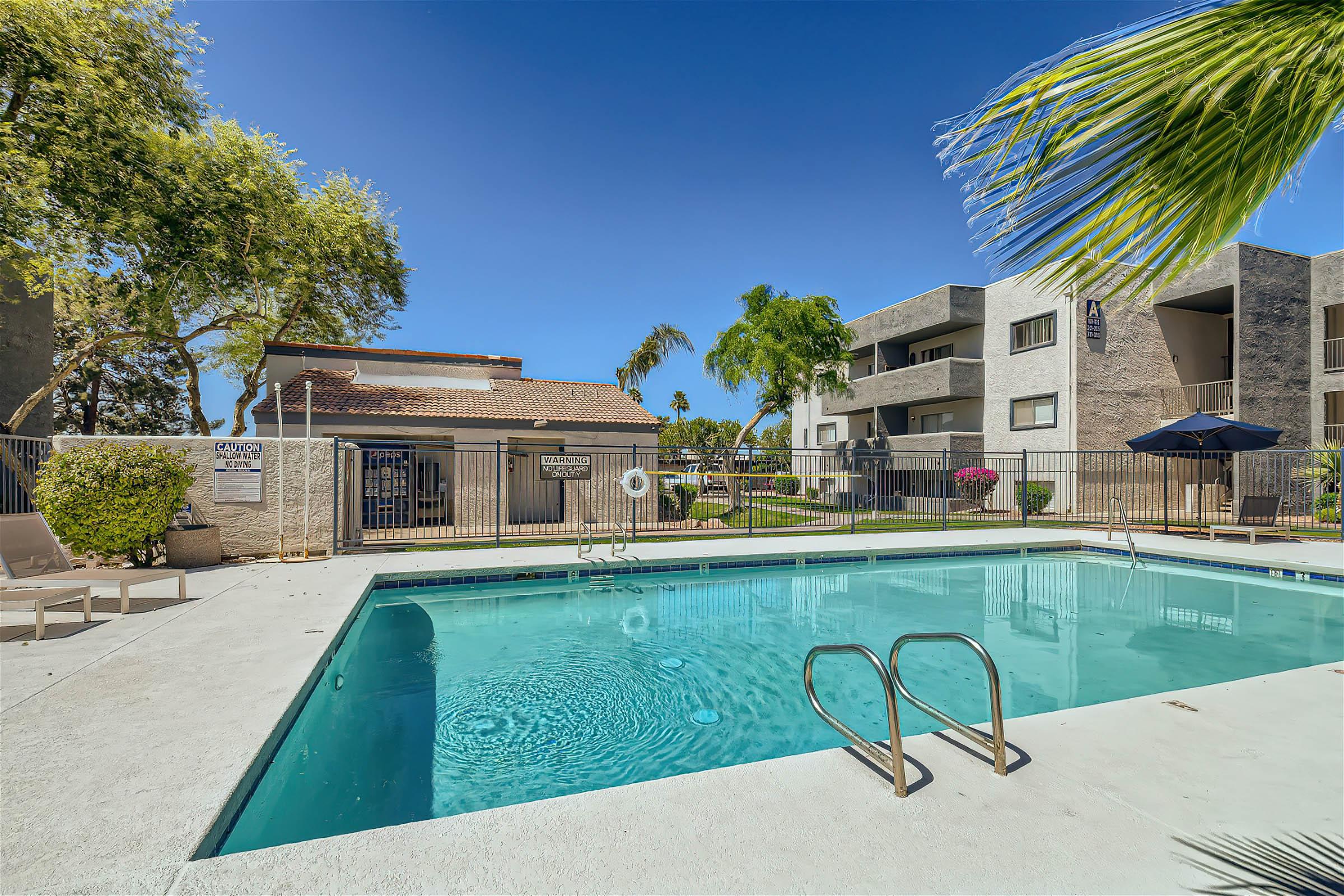 Outdoor Mesa, AZ apartment community swimming pool in a gated area at Rise at Dobson Ranch