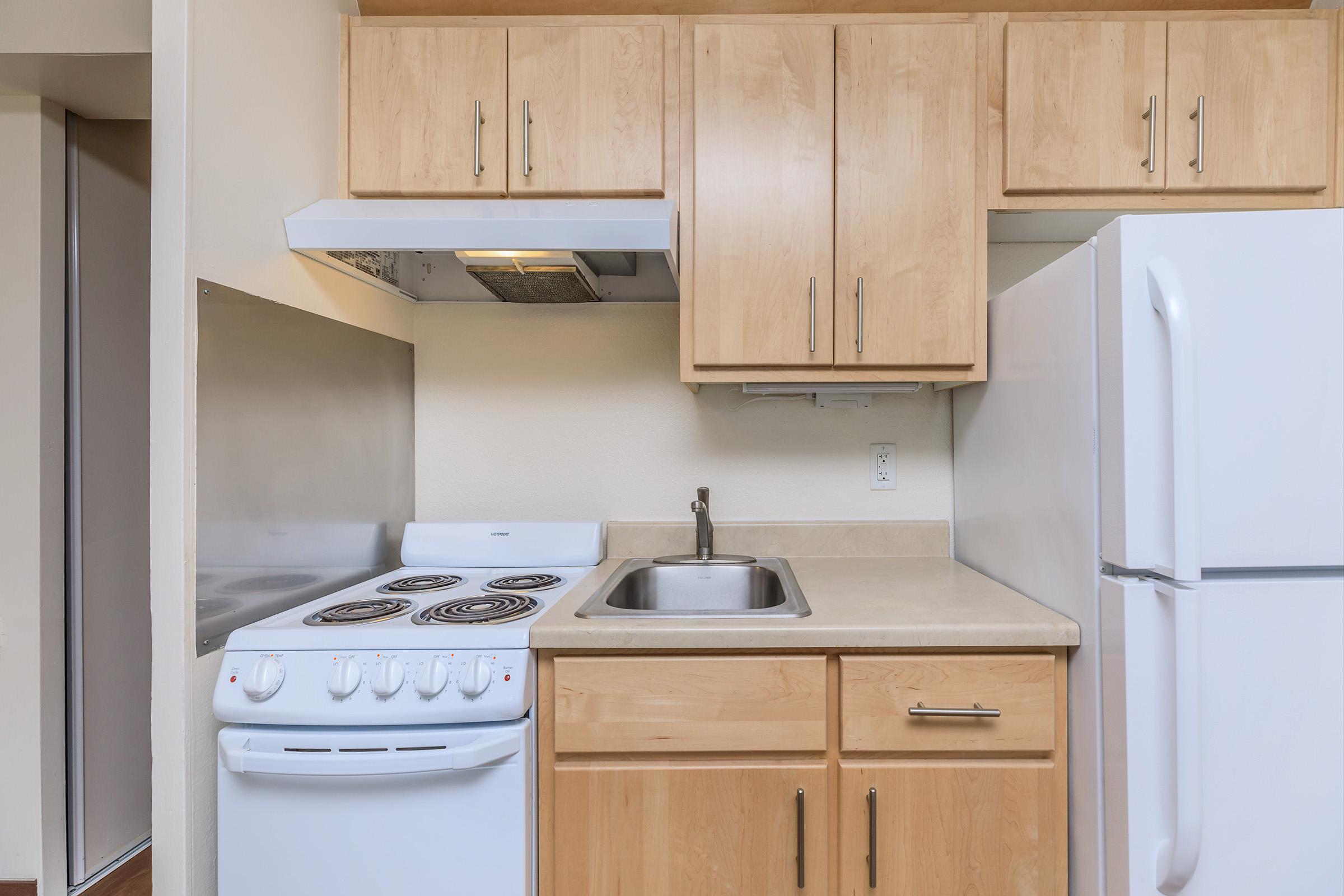 Unfurnished kitchen with wooden cabinets